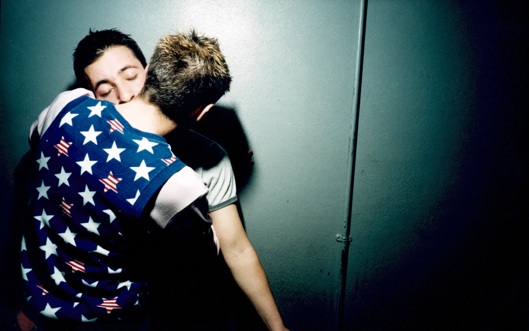 Gay couple kissing DTPM at Fabric, London, 2002. © Jason Manning / PYMCA