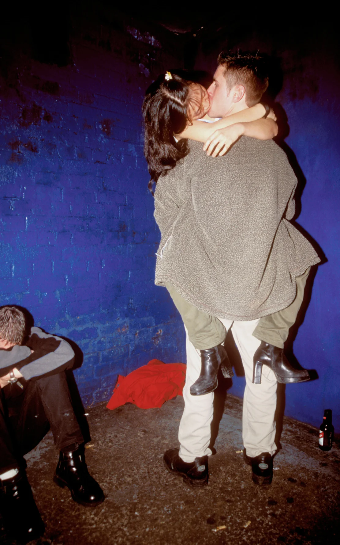 Standing couple snogging, her legs wrapped around his waist, Candy Flip, Bristol, UK, 2000’s. © Matthew Smith / PYMCA