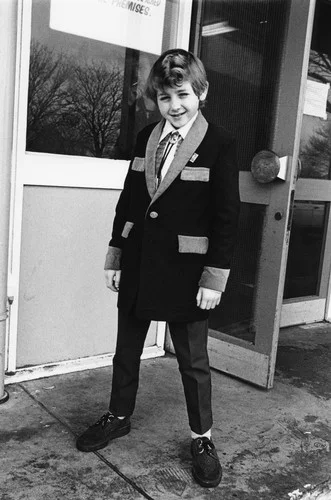 A kid wearing Teddy Boy styles, Caister weekender, UK 1980. ©Janette Beckman / PYMCA