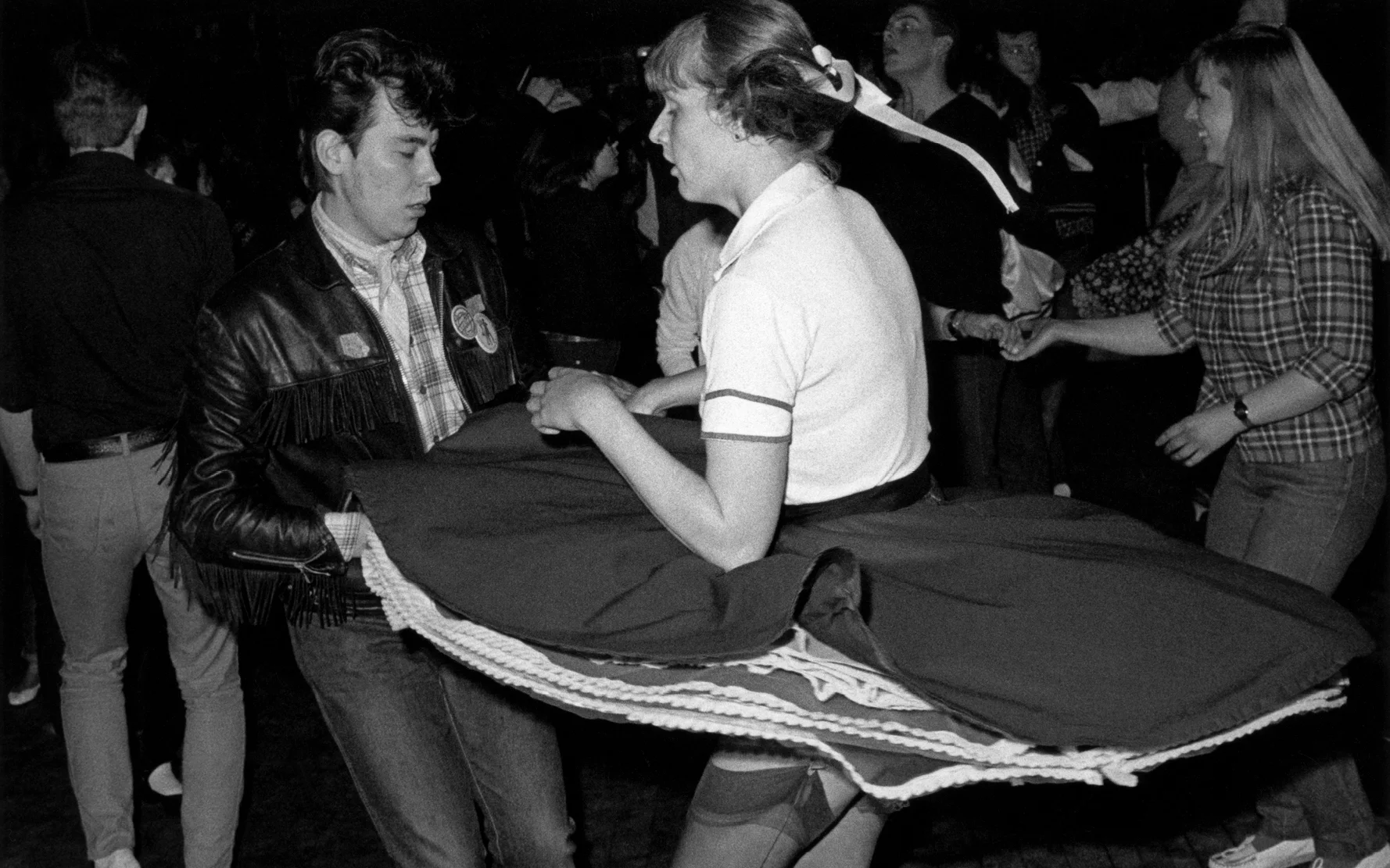A Teddy Boy couple Rock 'n' roll dancing, Caister, Great Yarmouth, UK 1980. © Janette Beckman / PYMCA