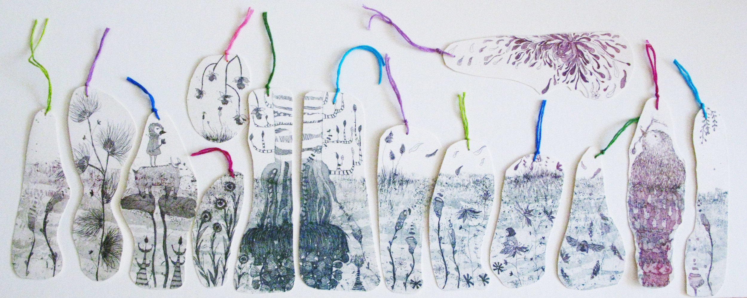 One of these etched bookmarks are included in the book.