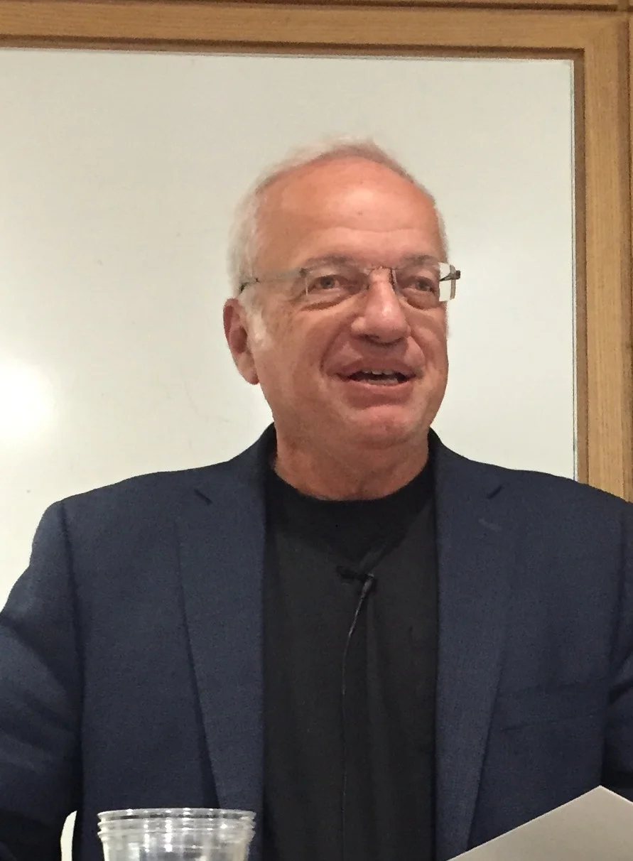 Michael Salcman, photo graphed here at a reading in November 2015 at the Columbia University Medical Center to celebrate the literary & fine arts journal, Reflexions , is a poet, neurosurgeon, and art historian, formerly chair of neurosurgery at the University of Maryland and president of the Contemporary Museum in Baltimore. He is the author of six medical textbooks and six collections of verse, including The Clock Made of Confetti and The Enemy of Good Is Better. Dr. Salcman reads the poem, "The Clock Made of Confetti" below.