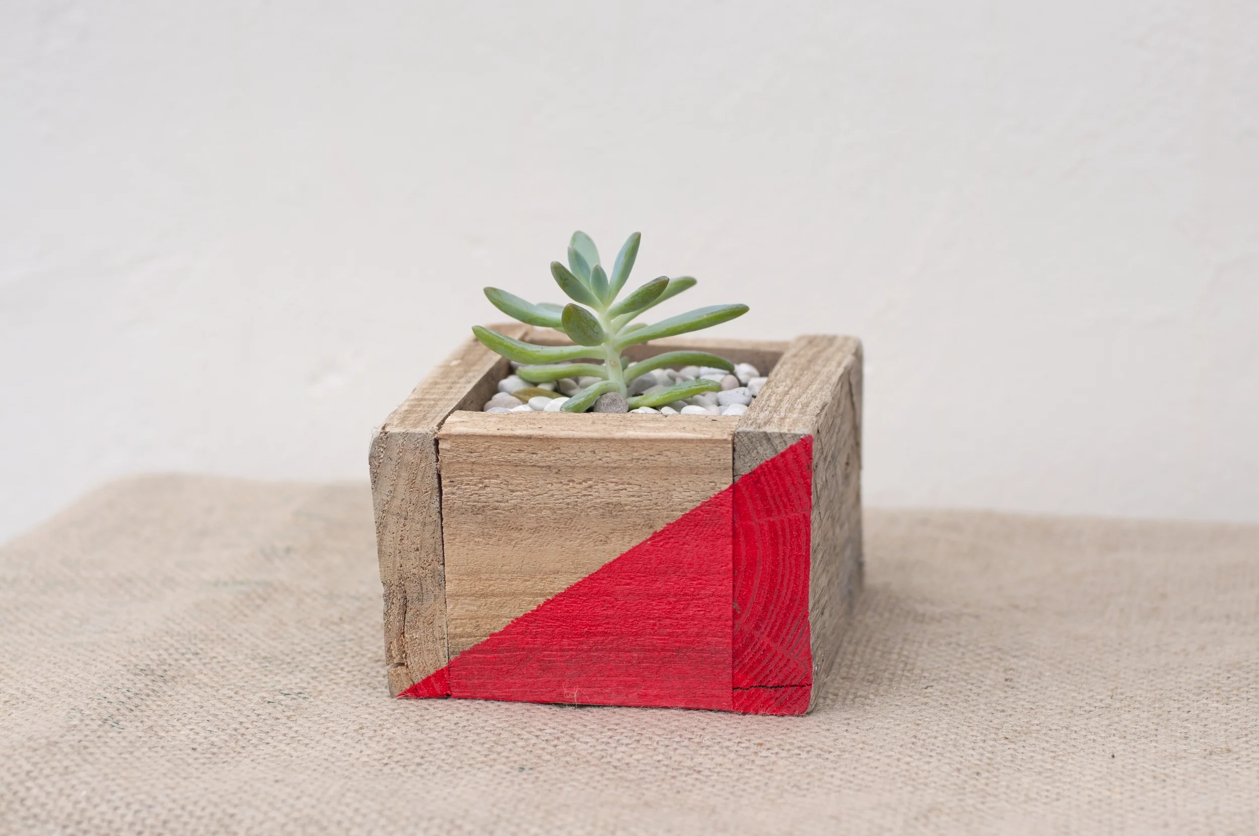 I used to be a pallet Recycled from a pallet, given new love by an electric saw, nails and some paint. Happy to live indoors or outdoors, they instantly brighten up any setting. 30cm wide, 15cm deep and 15cm tall $35 Available in a variety of sizes and colours.