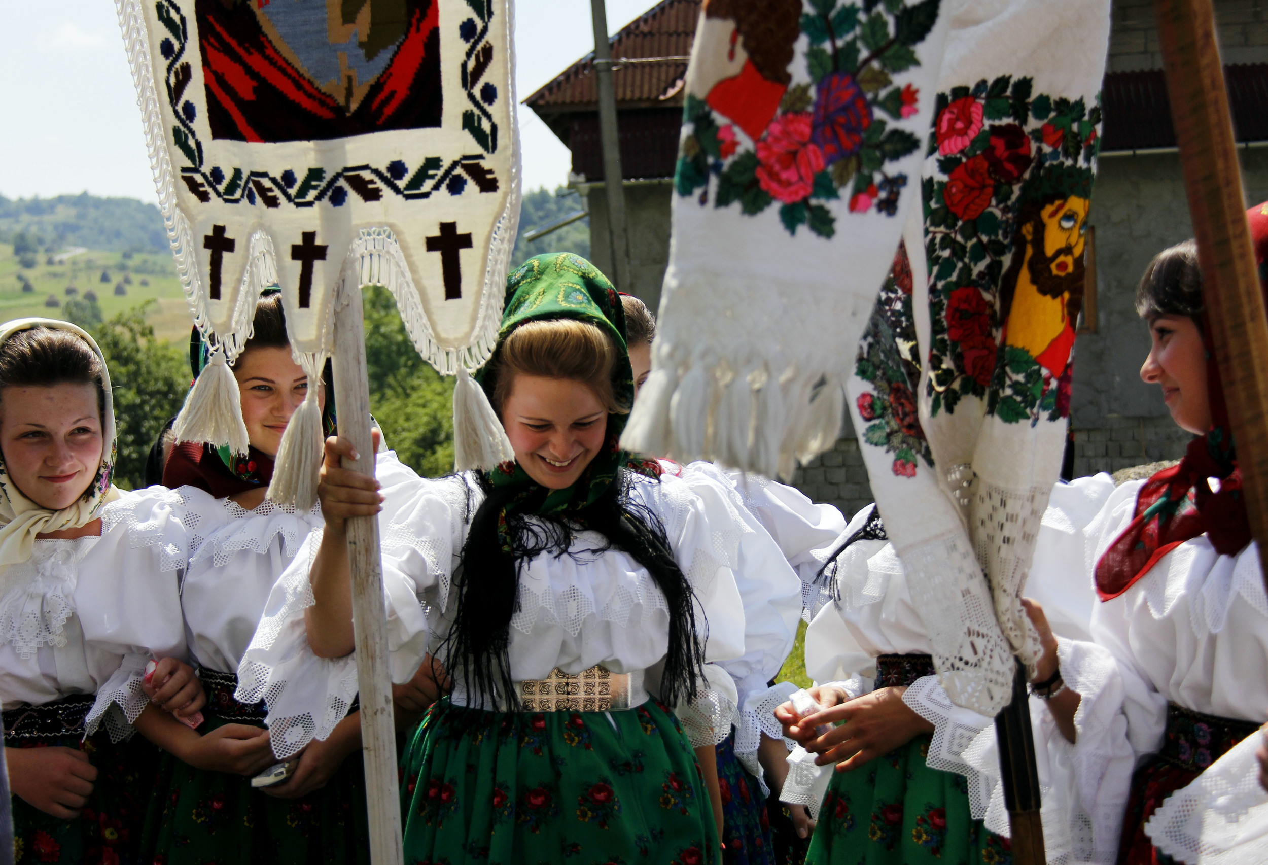 Maricica Bladea, a 16 year-old from a small town near the Maramures mountains, participates in the St. Peter's Day parade with her friends and neighbors who she has grown up with all her life.