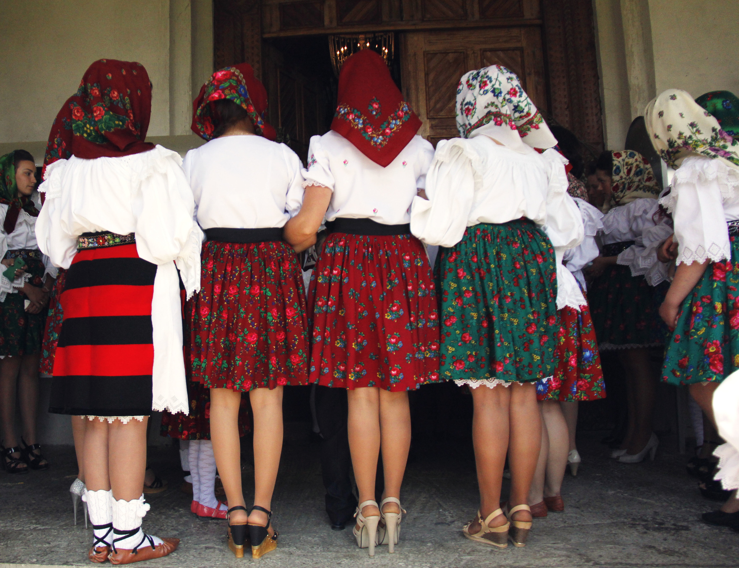 Breb's younger generation stands outside the church during mass because there is not enough room inside. Every Sunday the locals dresses in hand-made traditional clothing that has been passed down from generations when attending mass.
