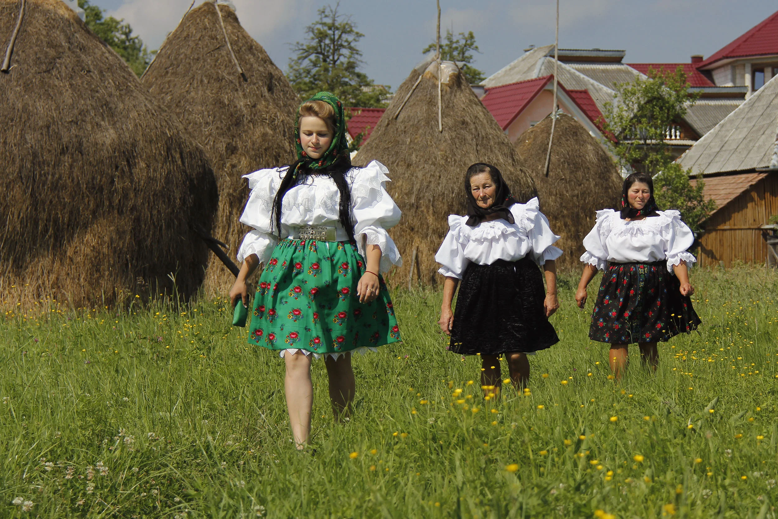  Marii, Iliana and Viorica head to Breb's Greek Orthodox Church for the St. Peter's Day mass. They, like the other villagers, create footpaths through the fields to use as a shortcut. 