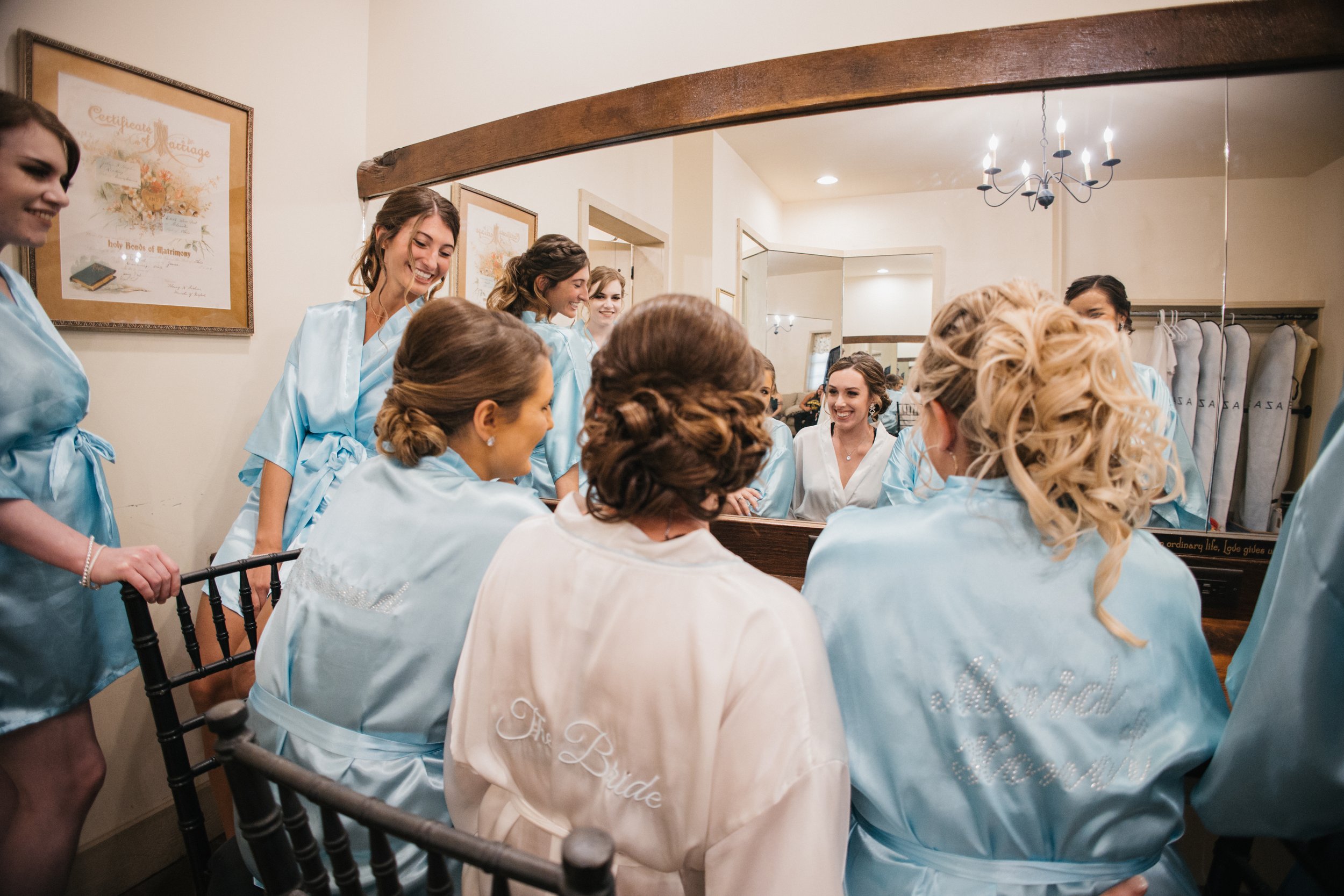 Bridesmaids getting ready in their pajamas.