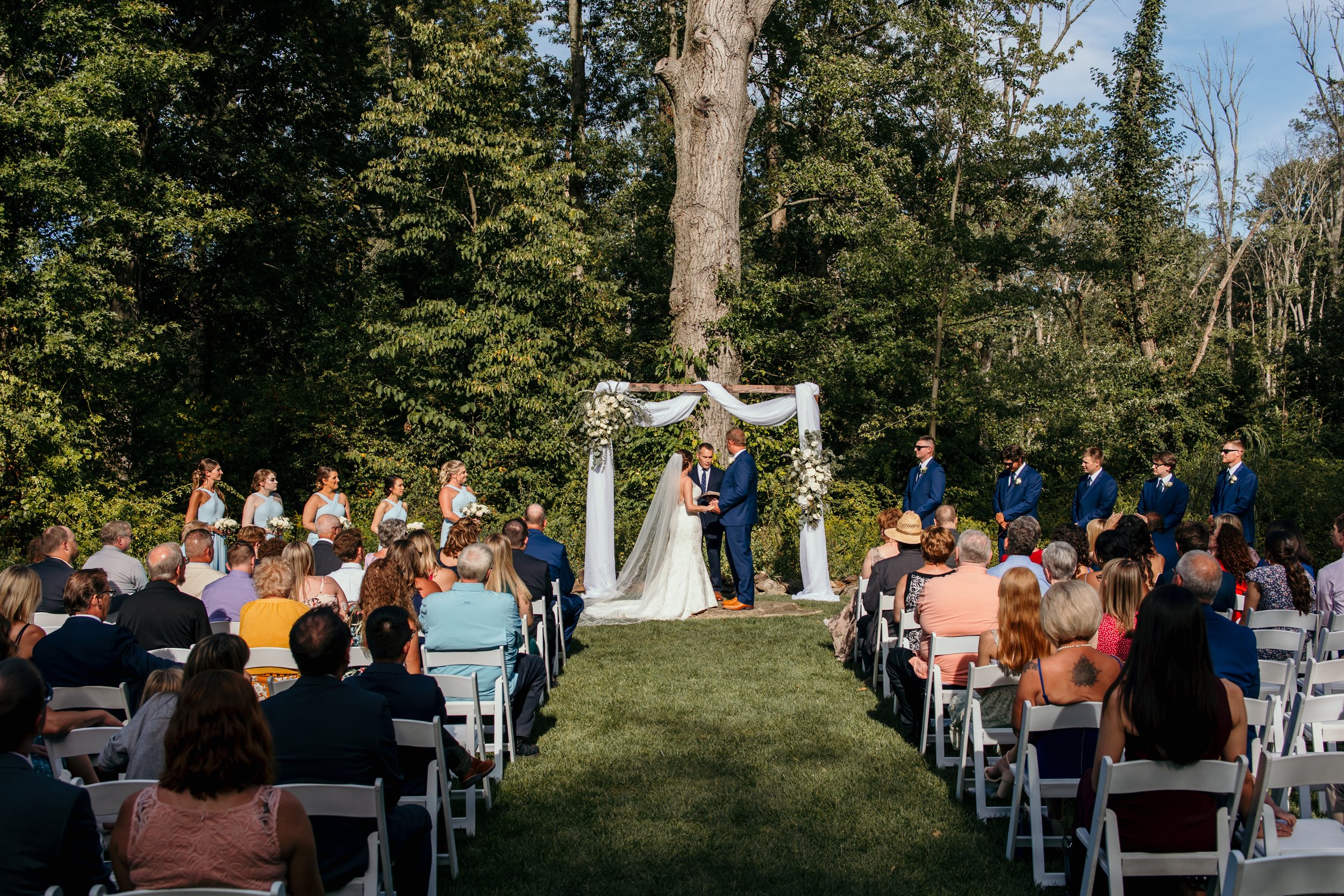 A outdoor wedding ceremony and brandywine manor house.
