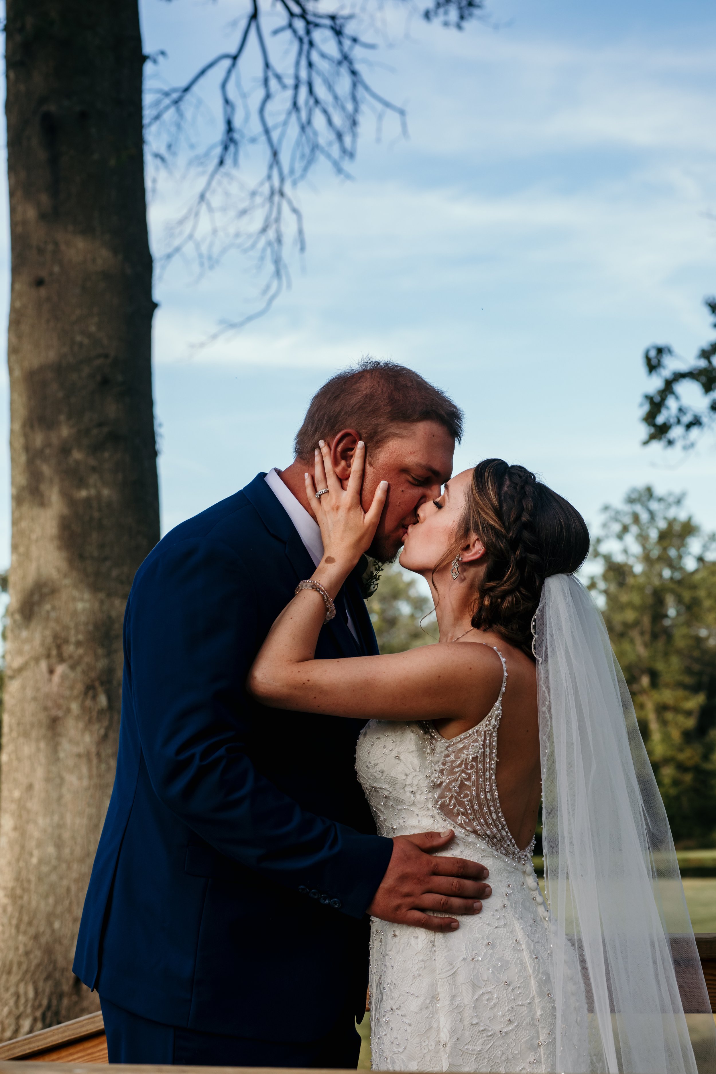 Bride and groom kiss, wedding pose.