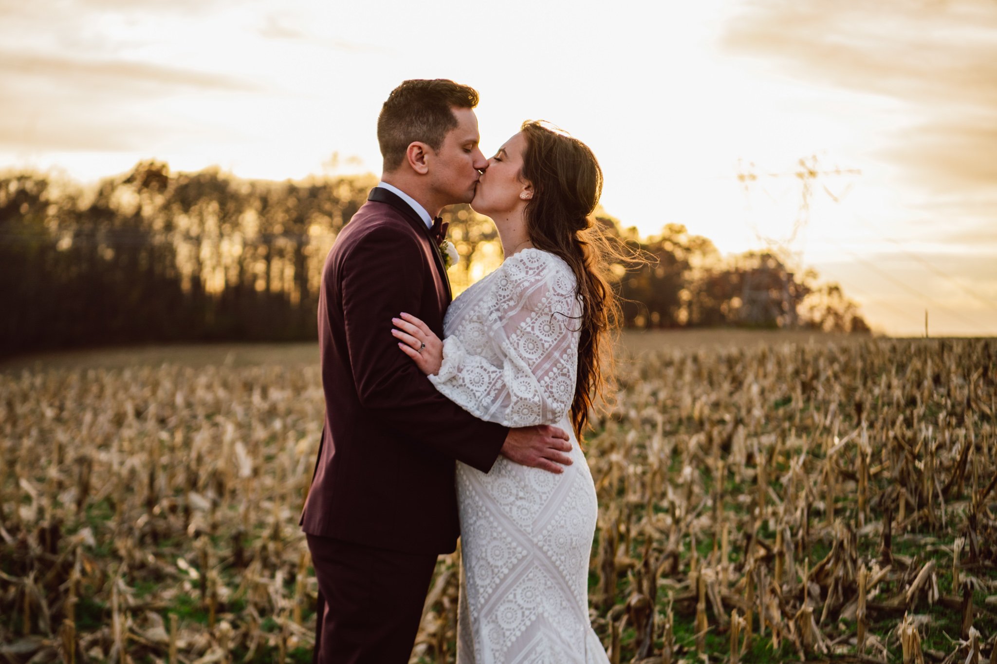 A wedding couple with a sunset on Turner Crossings Farm in Parkton Maryland.