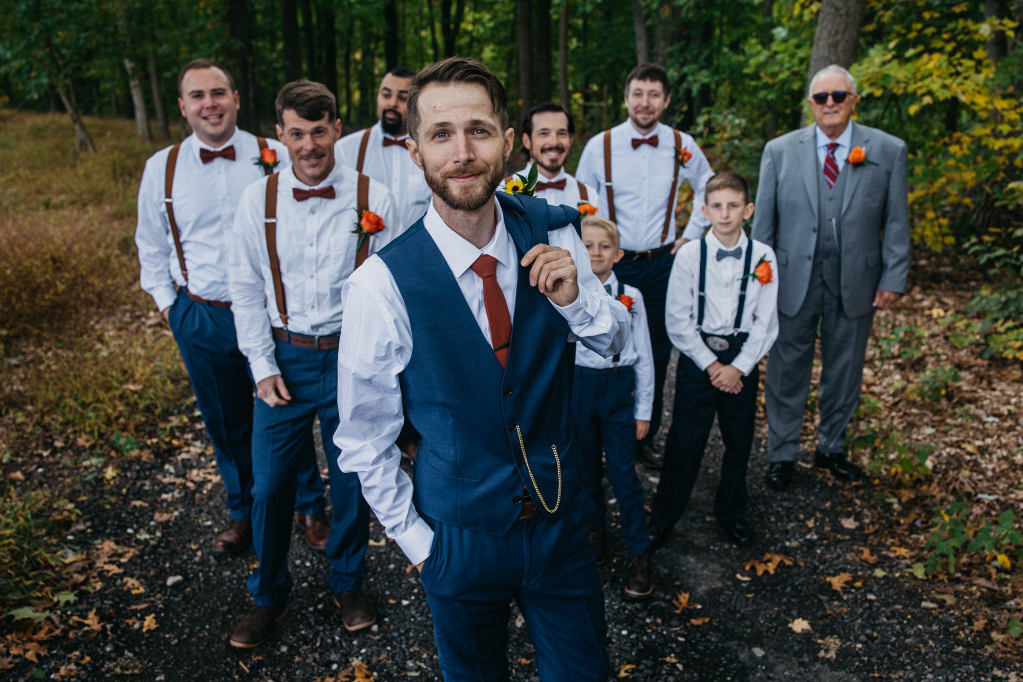 A groom and his groomsmen stand together.