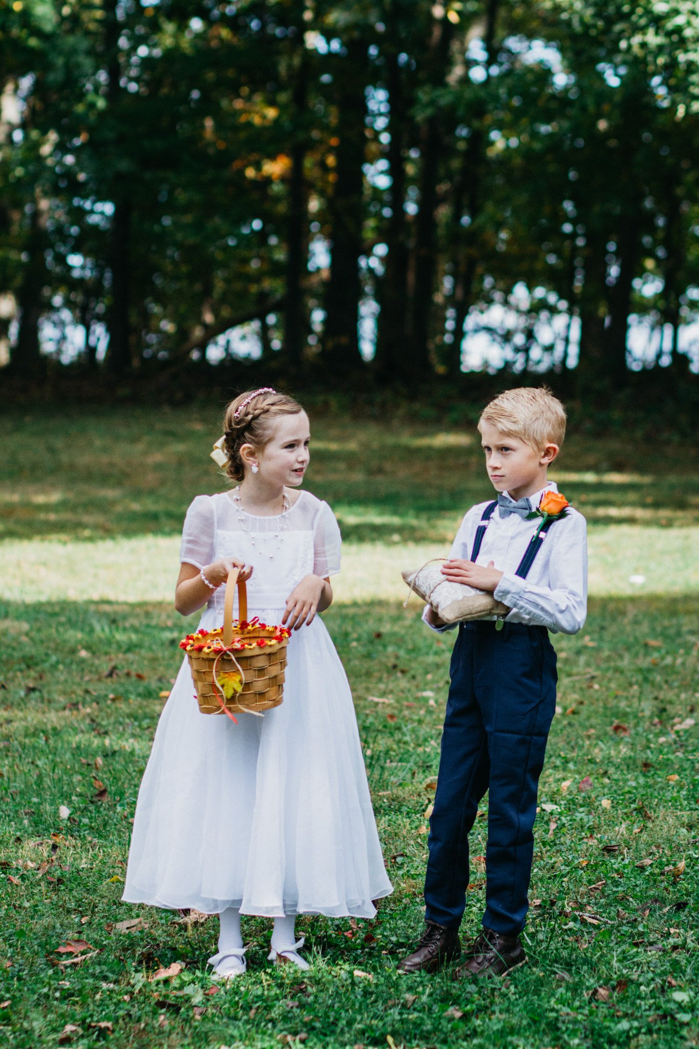 A flower girl and a ring bearer.