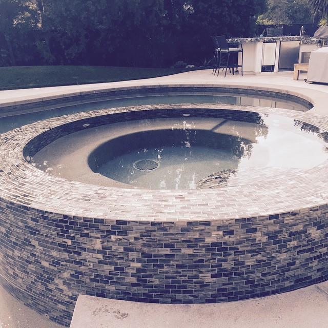 Glass tile perimeter overflow spa