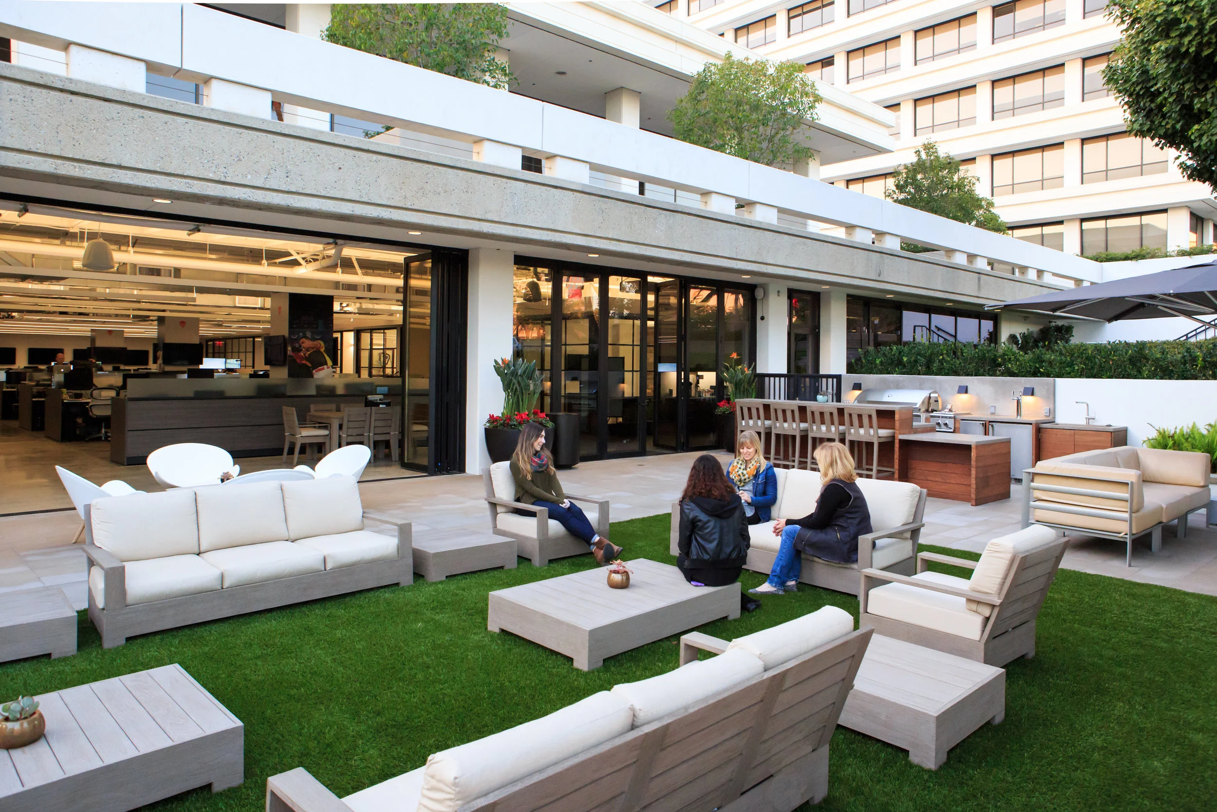 PARTY CENTRAL.... The existing 2,500 sf patio accessed by sliding/folding doors truly brought the outdoors-in and gave NextVR a place to have impromptu parties, team get-togethers, or private conversations. The outdoor area became one of the focal points of the space –defining their work philosophy to work hard, but also to relax and enjoy the moment. A full outdoor gourmet kitchen and bar area perfect for entertaining was created complete with a BBQ and even a two-tap beer dispenser. Add to that a 12’ fire pit surrounded by comfortable teak furniture and it became a haven for a bunch of techies working 24/7.