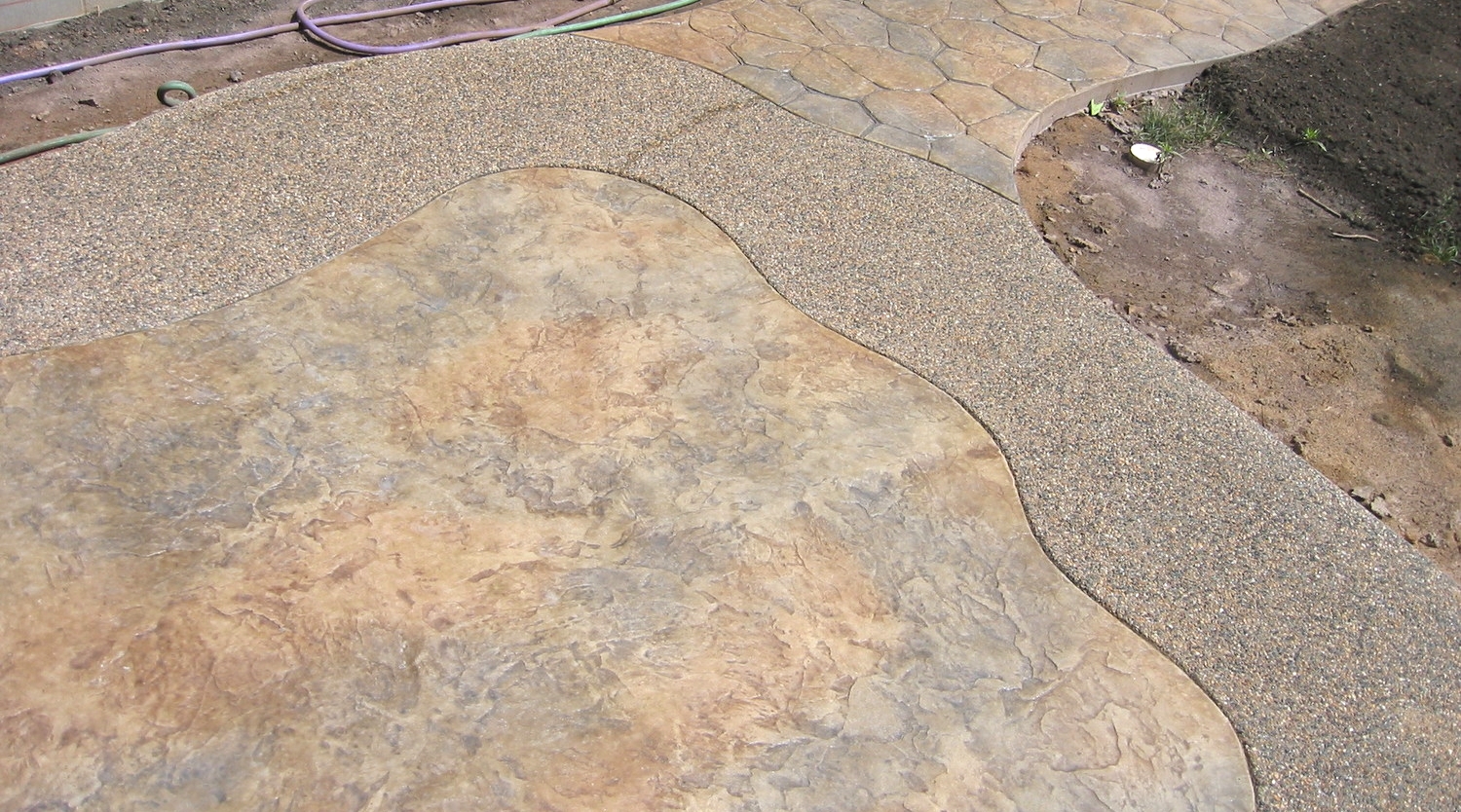 Stamped and Colored Concrete with Exposed Aggregate Border