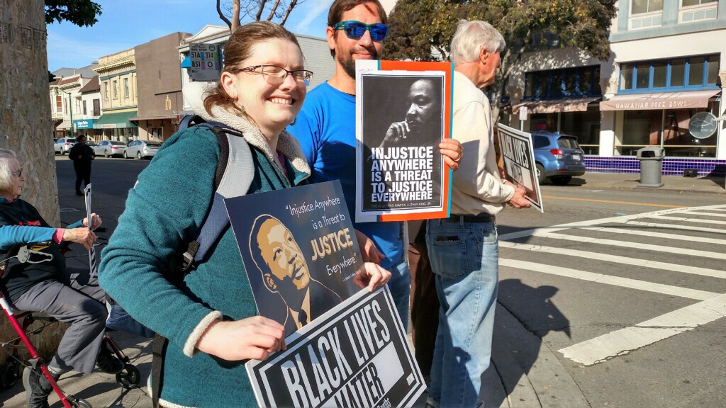 Alamedan's participating in a vigil on MLK Day.