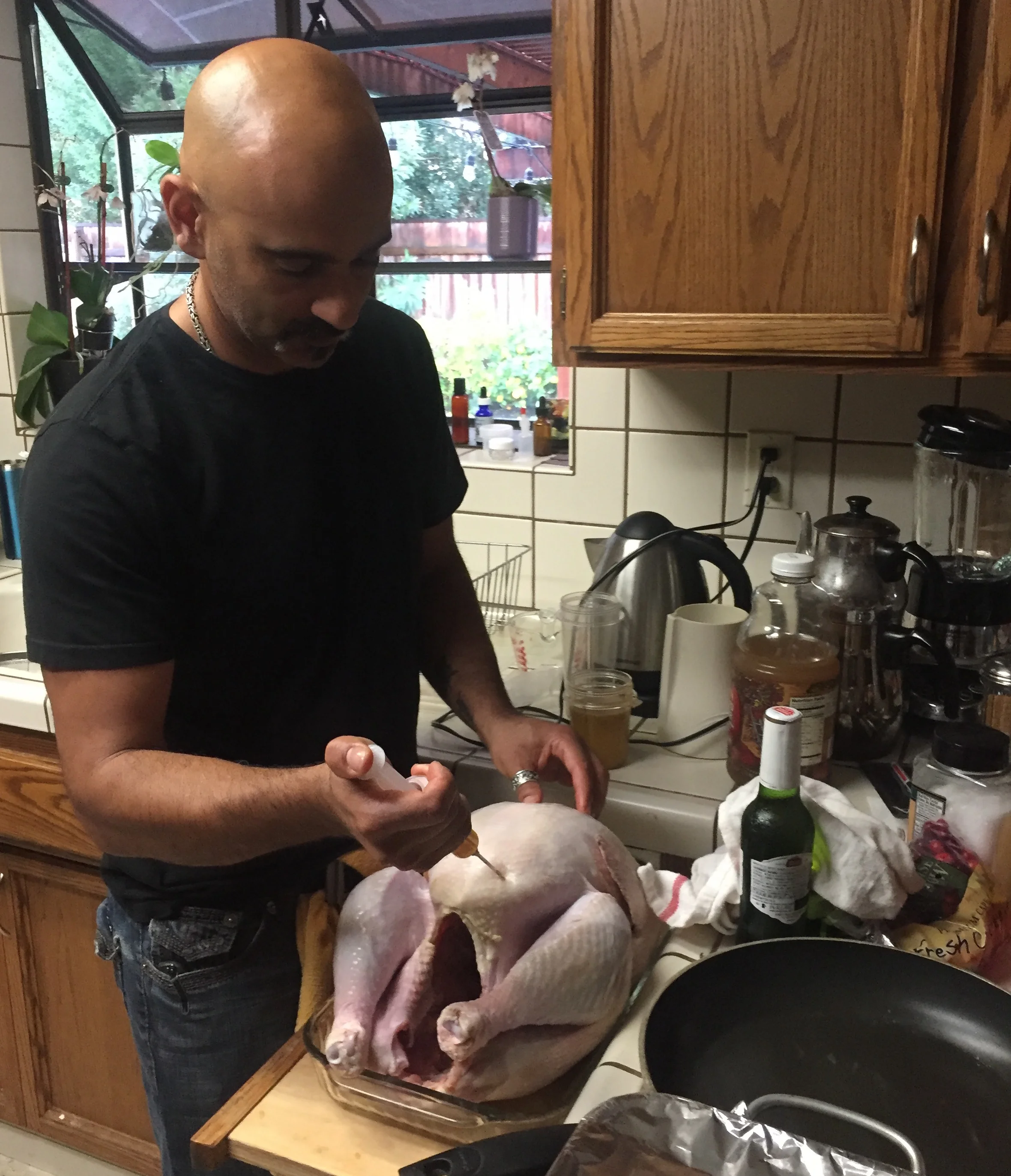 The turkey being prepared while I'm going through my wine-filled decision making process of how to stay healthy during the holidays. 