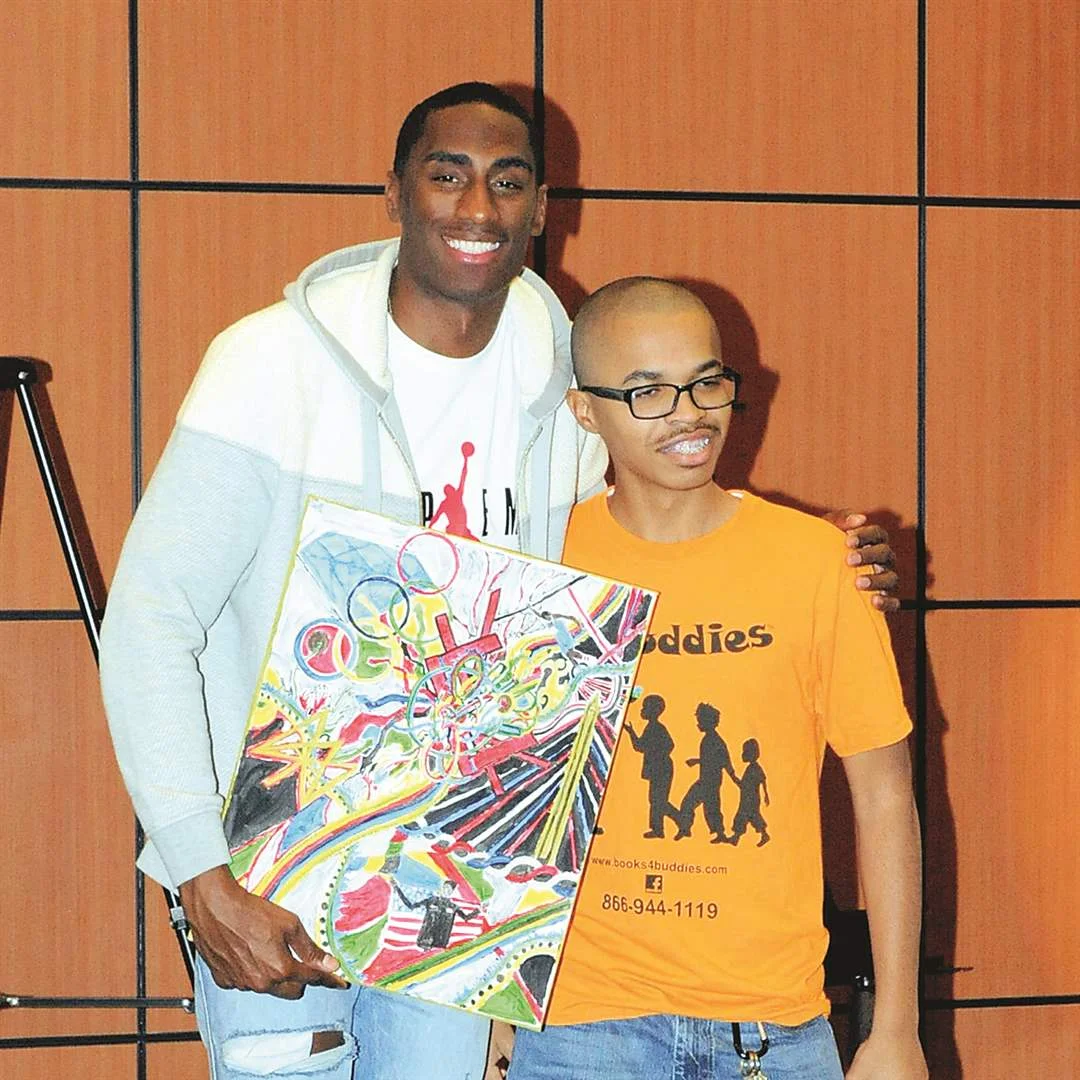 Erik Kynard, Jr. and Cheran Lyle at the Books 4 Buddies event in the McMaster Center at the Toledo-Lucas County Public Library.