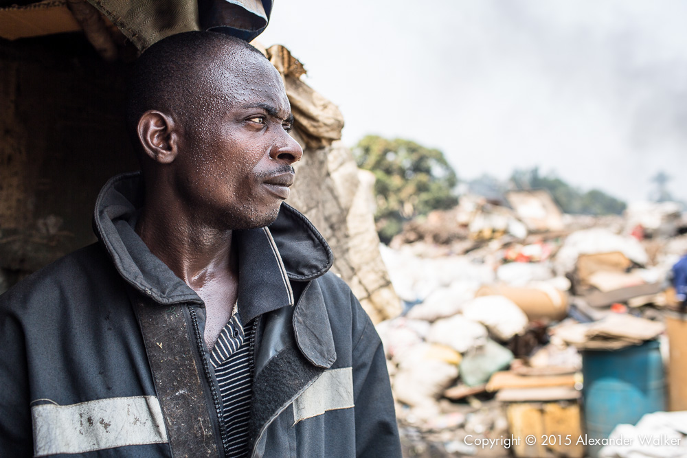  Hassan, Father of Osman stands outside his family home on the rubbish dump in which they live. One of many in Freetown, Sierra Leone.   Hassan and his family sort through the rubbish on the dump continuously, looking for anything valuable which can 