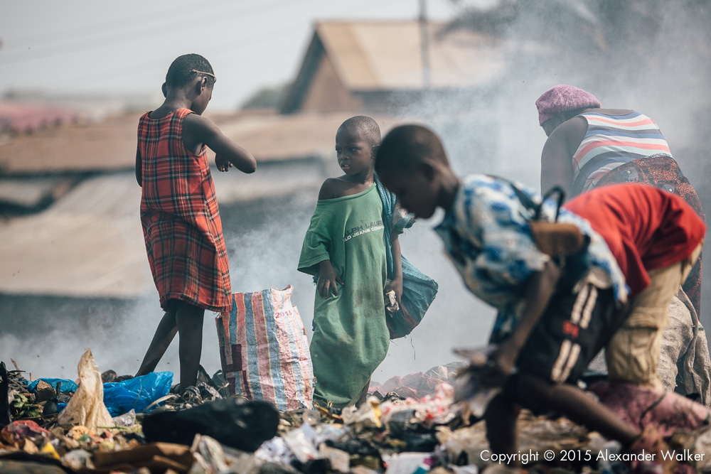  Osman 5 (Centre) sorts through rubbish with his family on one of the many dumps in Freetown.  He is looking for anything valuable which can either be recycled,  or sold on.  Comic Relief awarded Childhope UK funds to work with local charity Street C