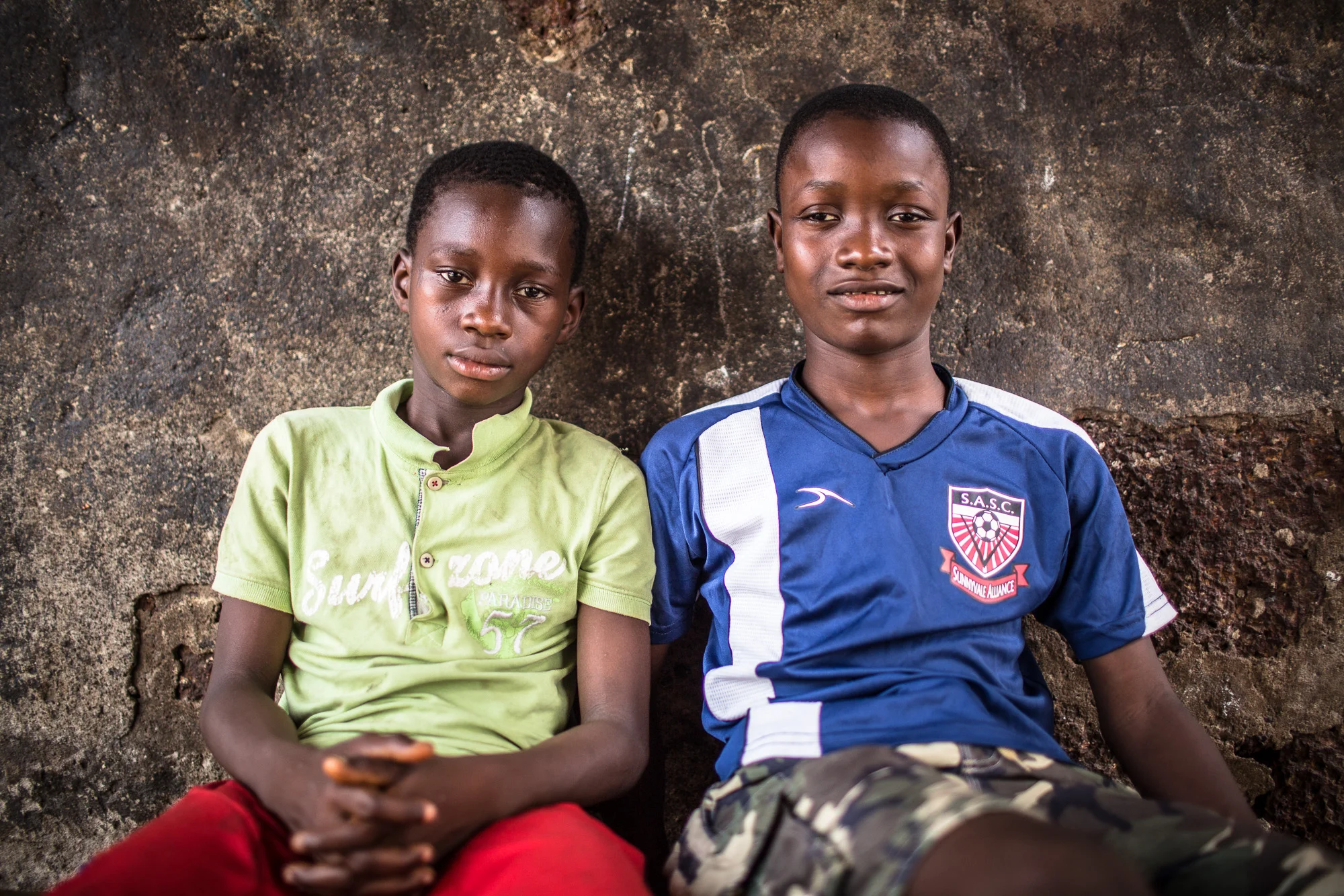 Brothers Musa 8 (L) and Muhammad 12 (R). Musa and Muhammad, both aspiring laywers lost both their parents in the Ebola outbreak in 2014 and are now looked after by their Aunt Fatmata. Y-Care interneational and local partner YMCA Sierra Leone were granted funds by Comic Relief to provide 1800 unemployed young people with training, academic skills as well as mentoring to assist them in finding jobs. In addition, an awareness raising campaigns on hygine, with a bid to educating the population on the causes and spread of Ebola.