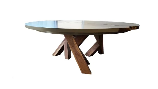 This original designed table is one of our favorites. Great for a large dining space that can accommodate a round table; this piece makes a statement like no other. Integrating a live edge slab along the top with flanking solid colour maple pieces to fill in the rest of the circle, this piece is one to be admired. The sturdy triple base is out of the way for leg room when this table is at the recommended size of 72" in diameter. Shown in solid Walnut and a light gray