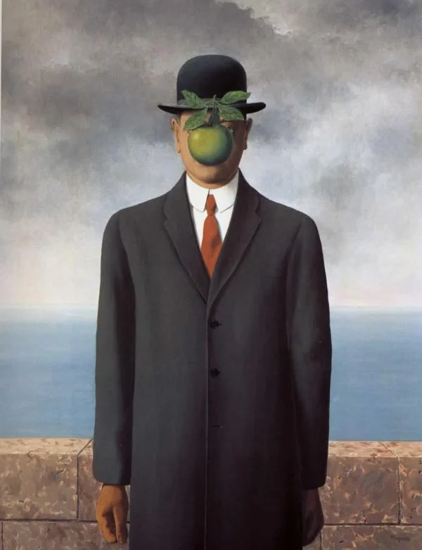 Our source of inspiration for the suits comes from The Son of Man by Rene Magritte