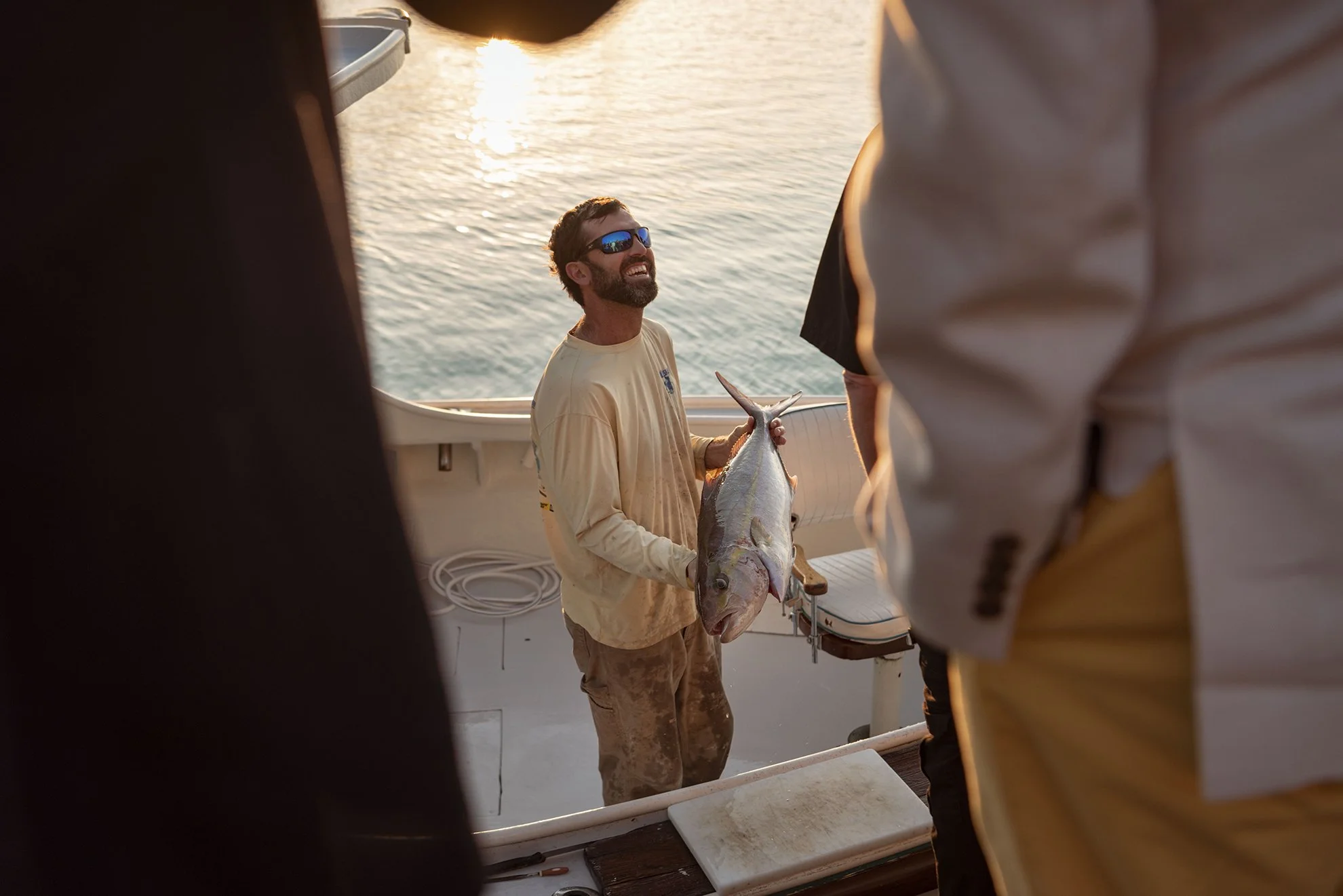  Capt. Jim West of Early Bird Charters sells his day’s catch to a local chef for a dinner organized by Das Fete for Condé Nast on March 27, 2020 at Bailey’s Bay Dock in Bermuda. 
