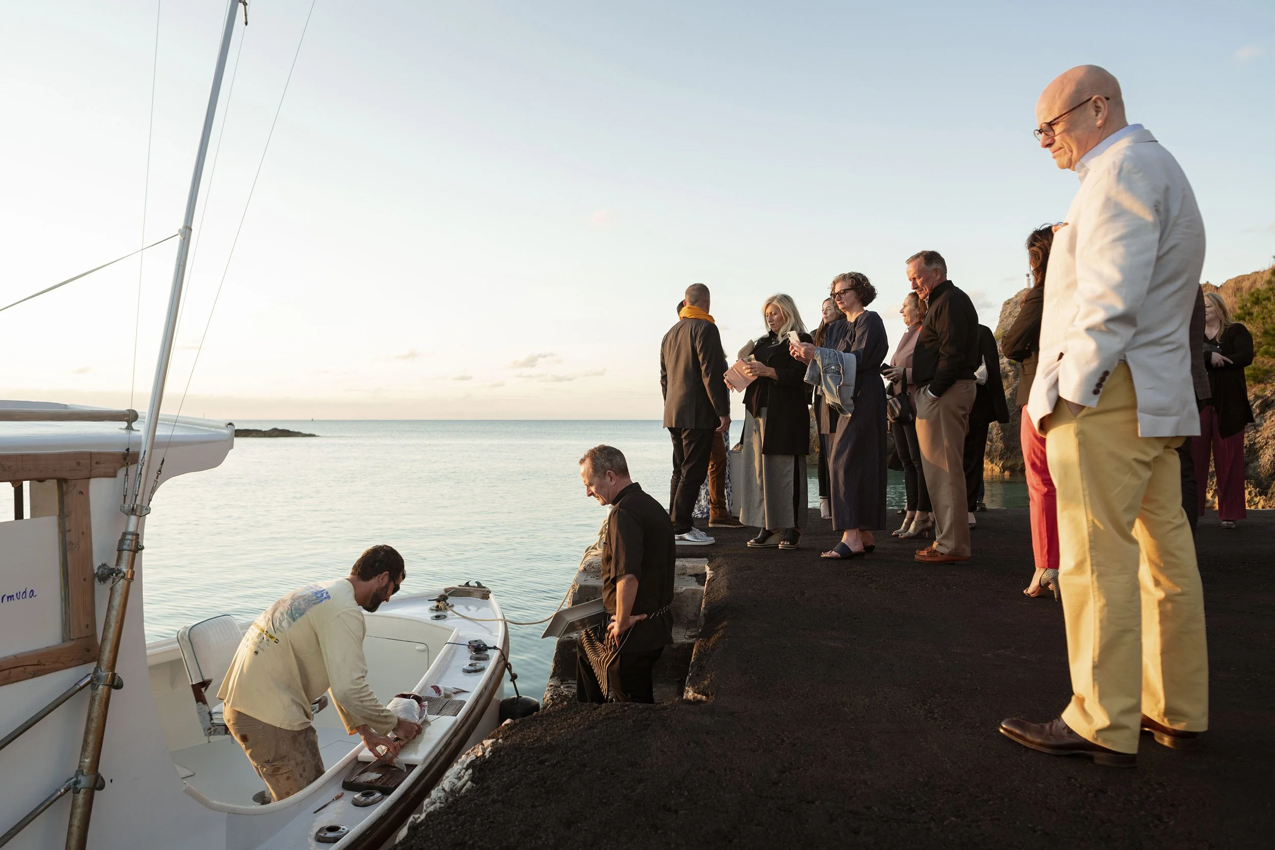  Capt. Jim West of Early Bird Charters sells his day’s catch to a local chef for a dinner organized by Das Fete for Condé Nast on March 27, 2020 at Bailey’s Bay Dock in Bermuda. 