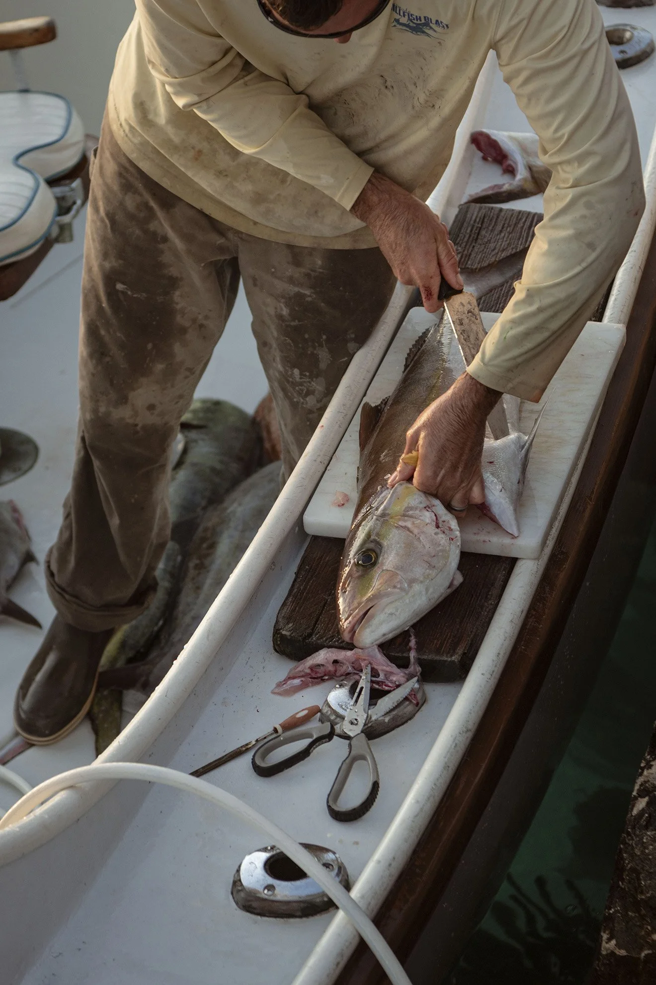  Capt. Jim West of Early Bird Charters sells his day’s catch to a local chef for a dinner organized by Das Fete for Condé Nast on March 27, 2020 at Bailey’s Bay Dock in Bermuda. 