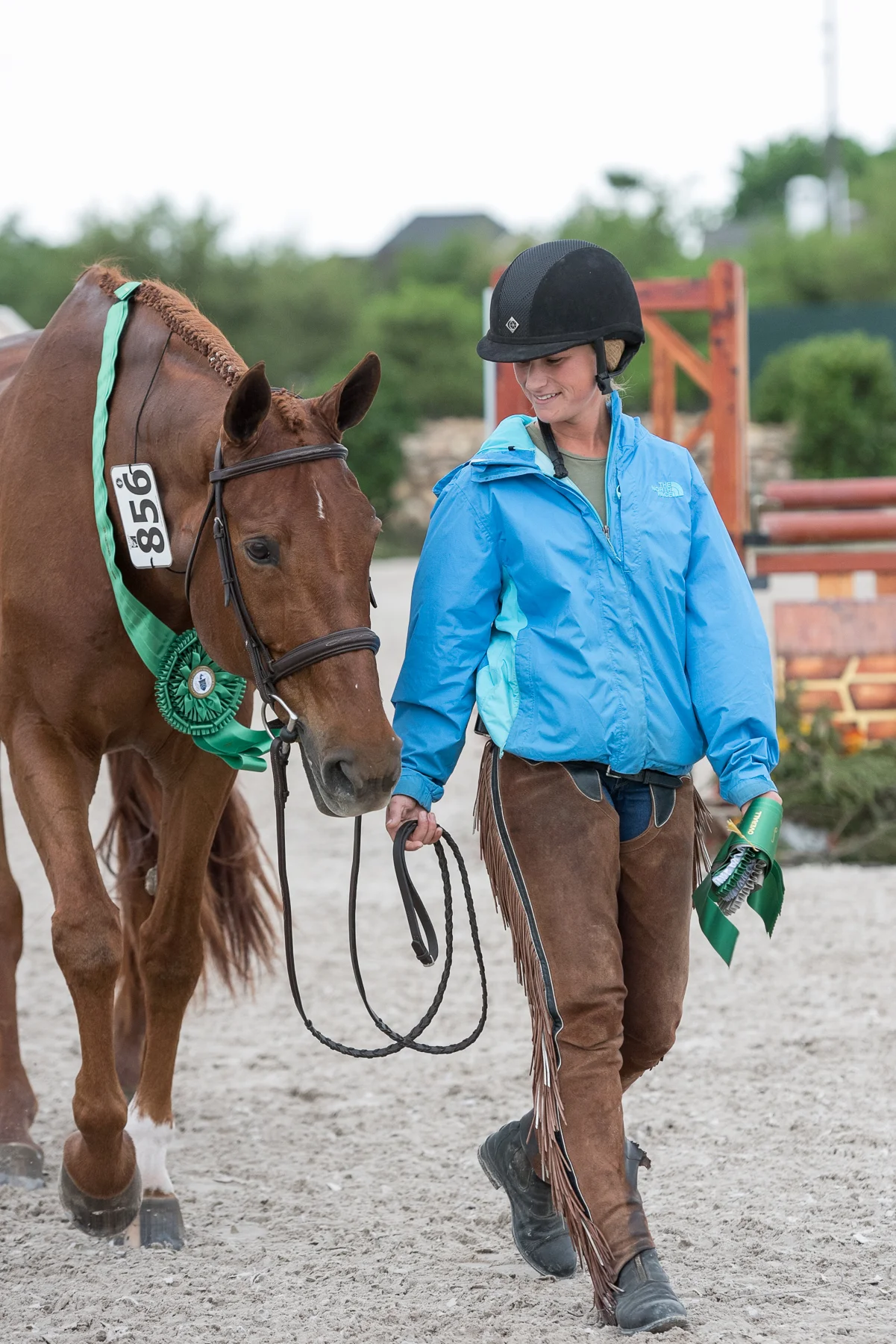 Alicia Heberle and Miss Lucy with her sixth-placed ribbon in the USHJA International Hunter Derby at Pin Oak I.