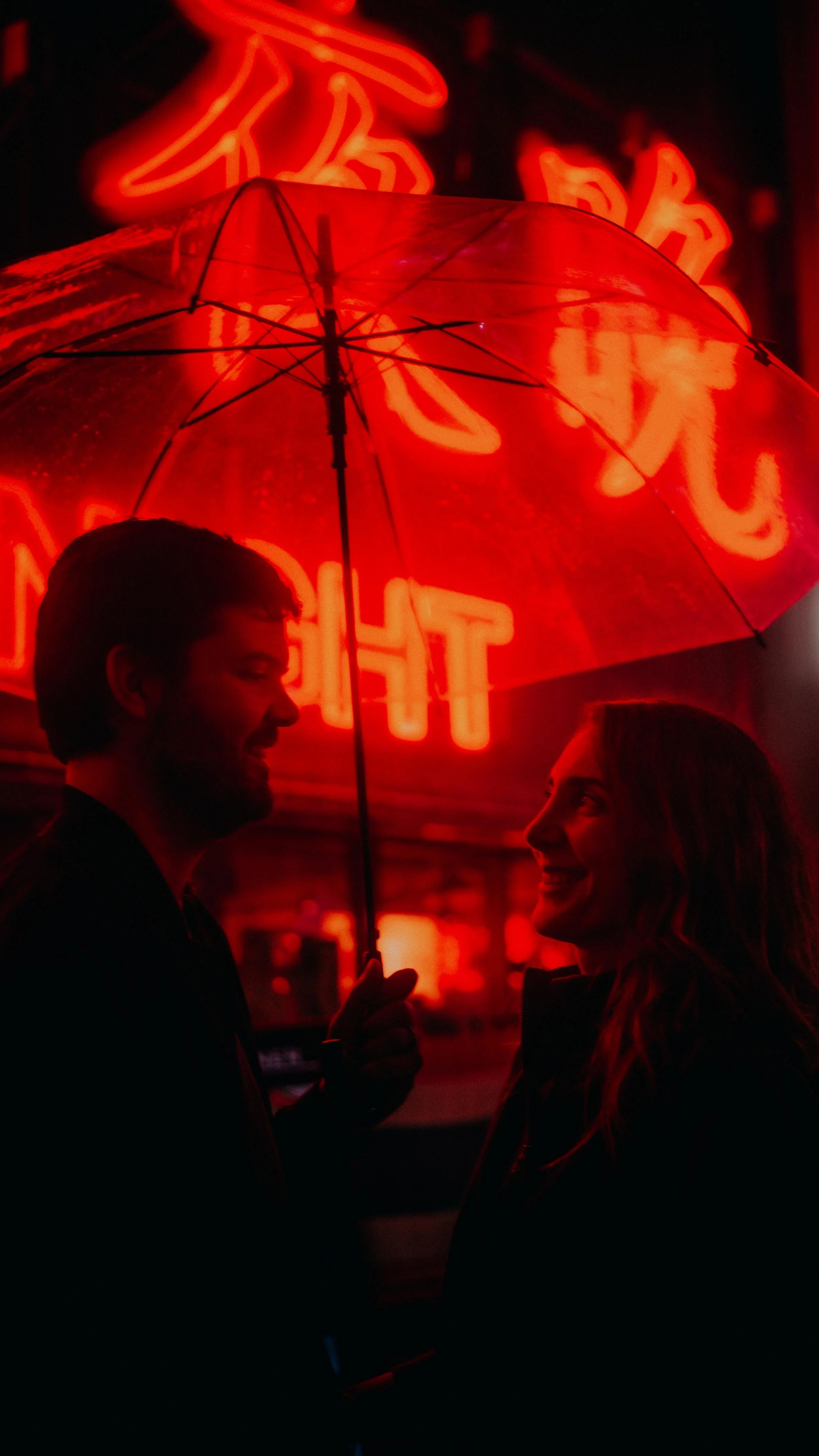 20-tokyo-couple-neon-laughter-portrait-hasselblad-x2d.jpg