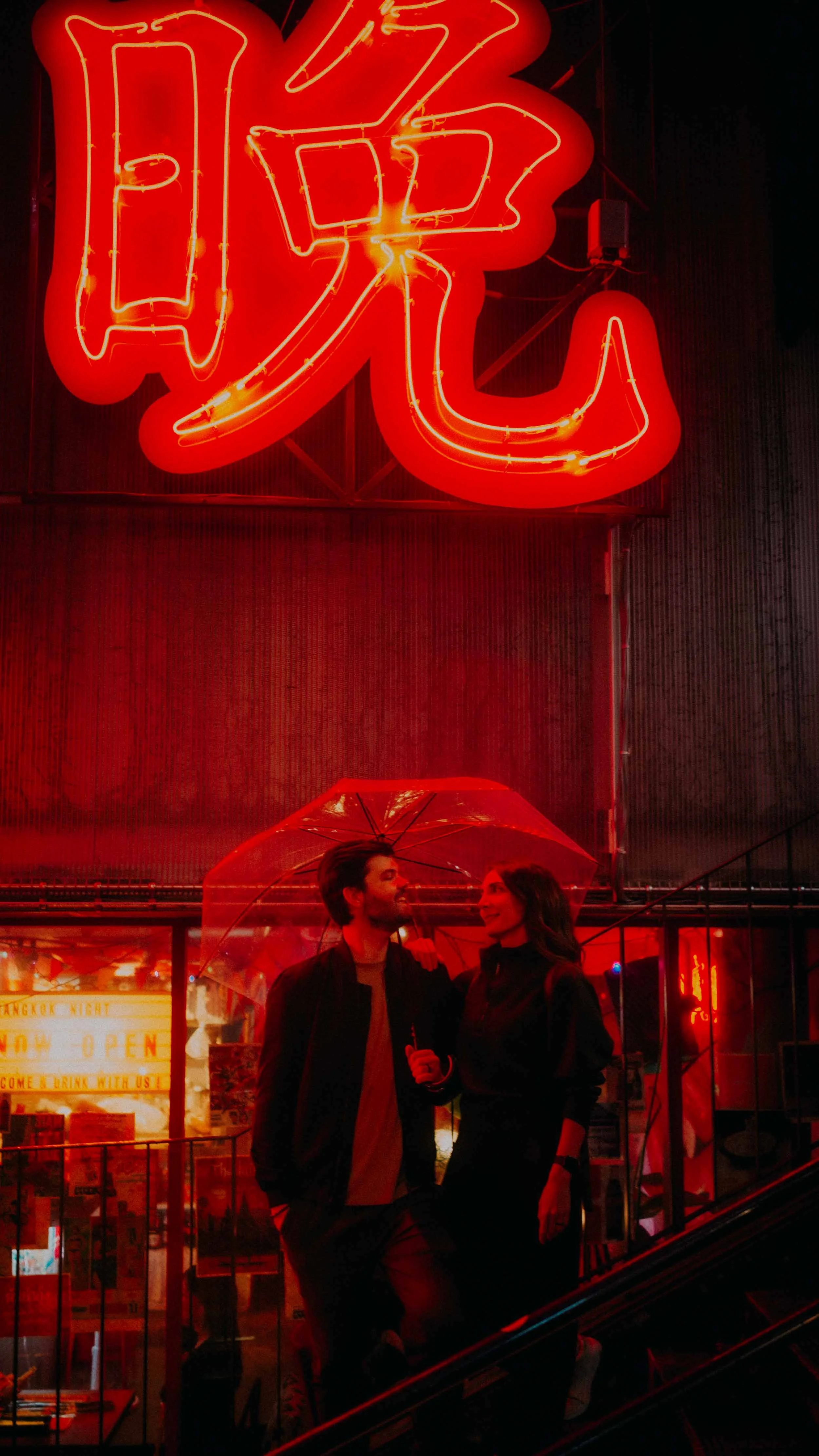 23-tokyo-couple-red-neon-stairwell-leica-q3.jpg