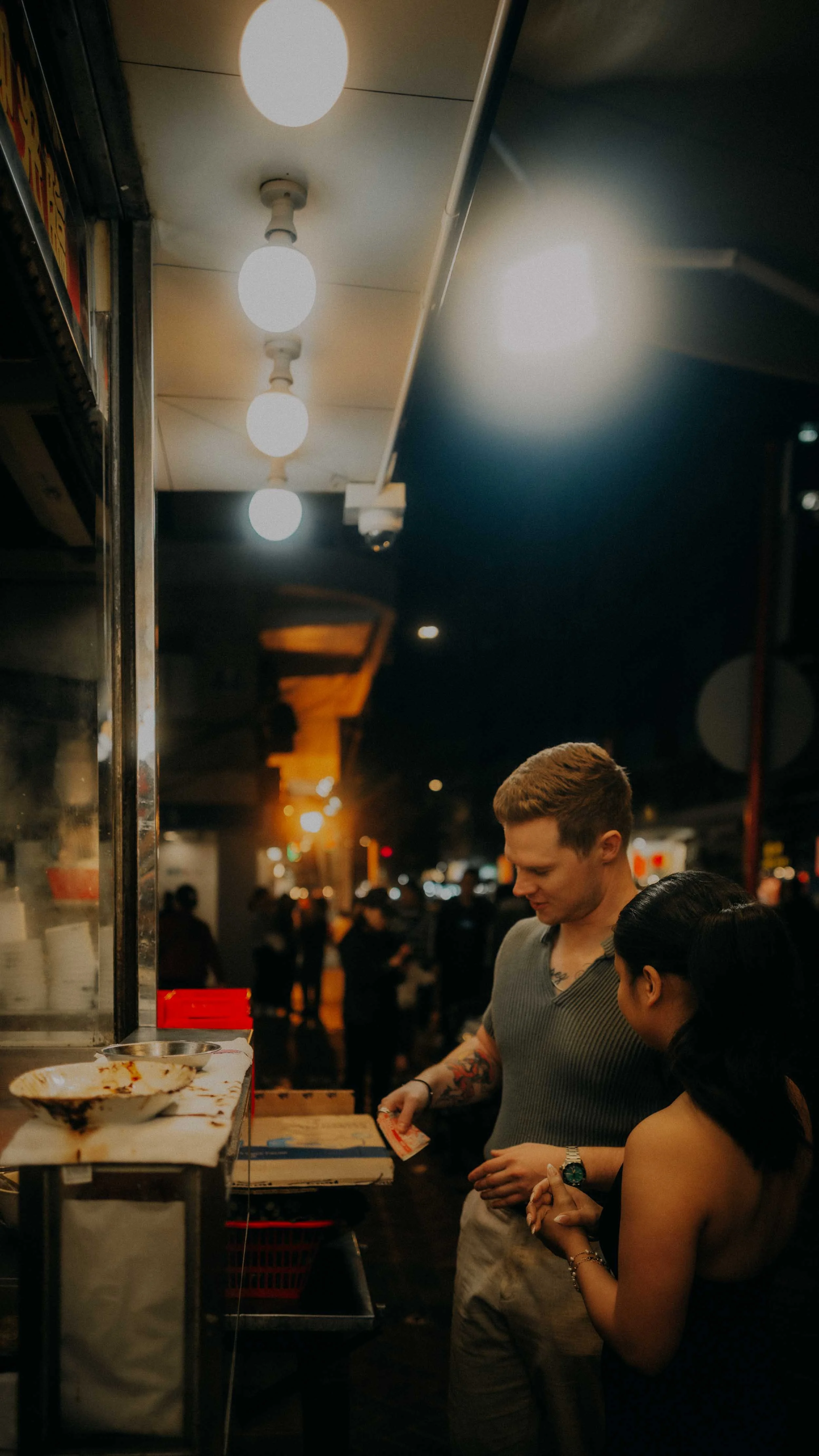 6-hong-kong-engagement-session-night-street-food-candid-portrait-leica-q3.jpg