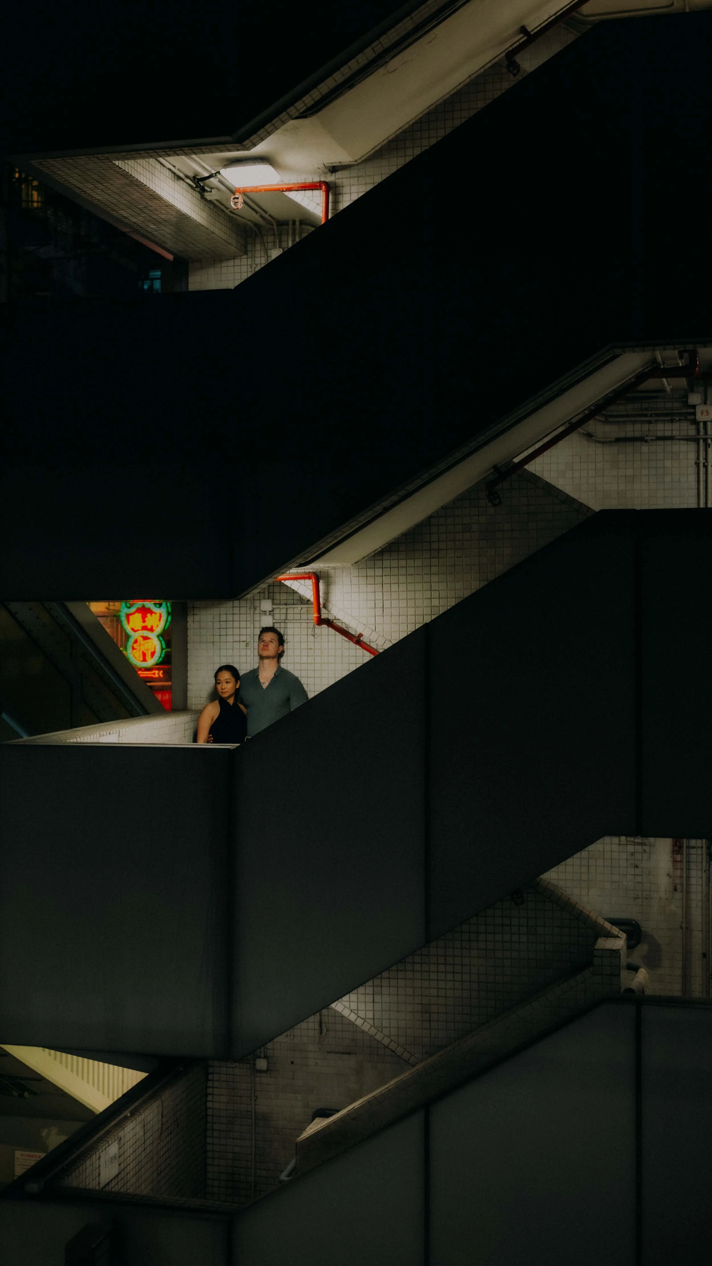 16-hong-kong-engagement-session-night-mong-kok-stairwell-neon-portrait-leica-sl2.jpg