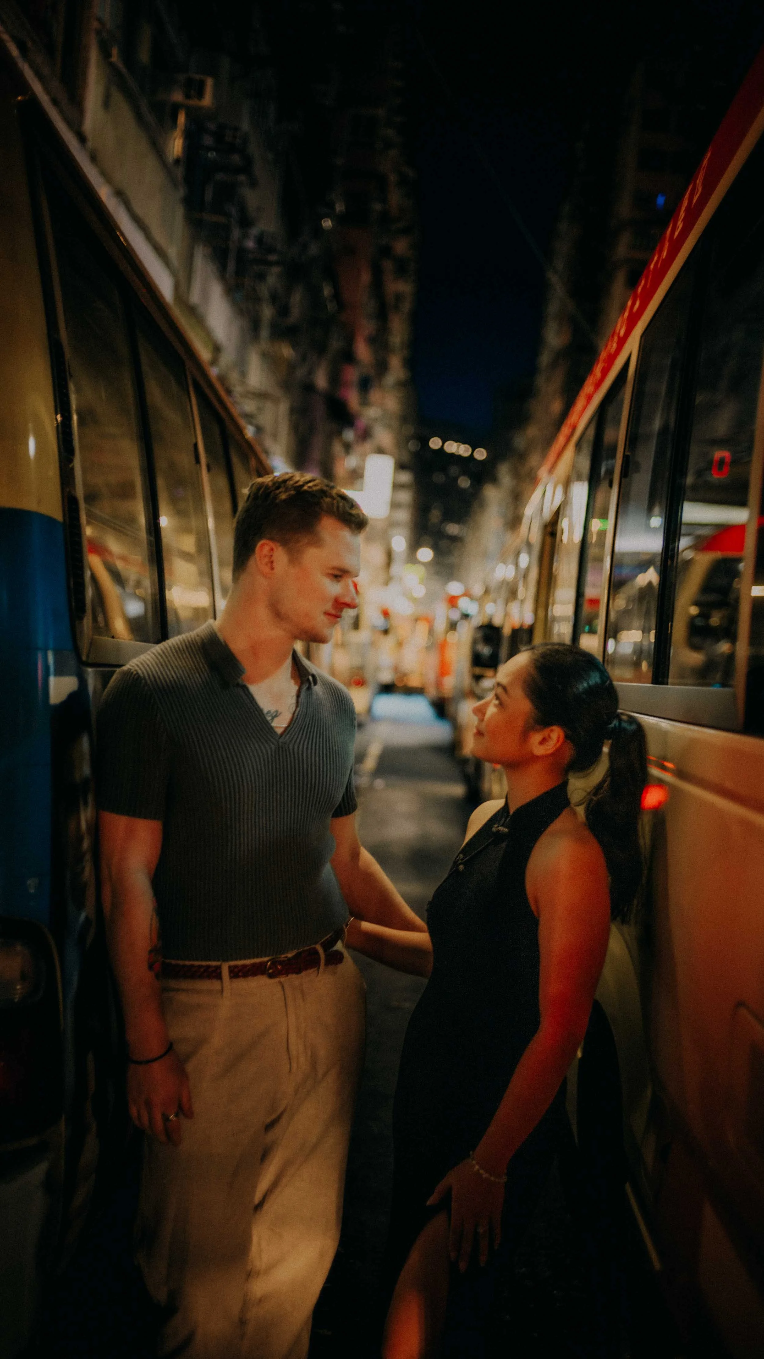 36-hong-kong-engagement-session-between-queued-light-buses-mong-kok-night-portrait-leica-sl2.jpg