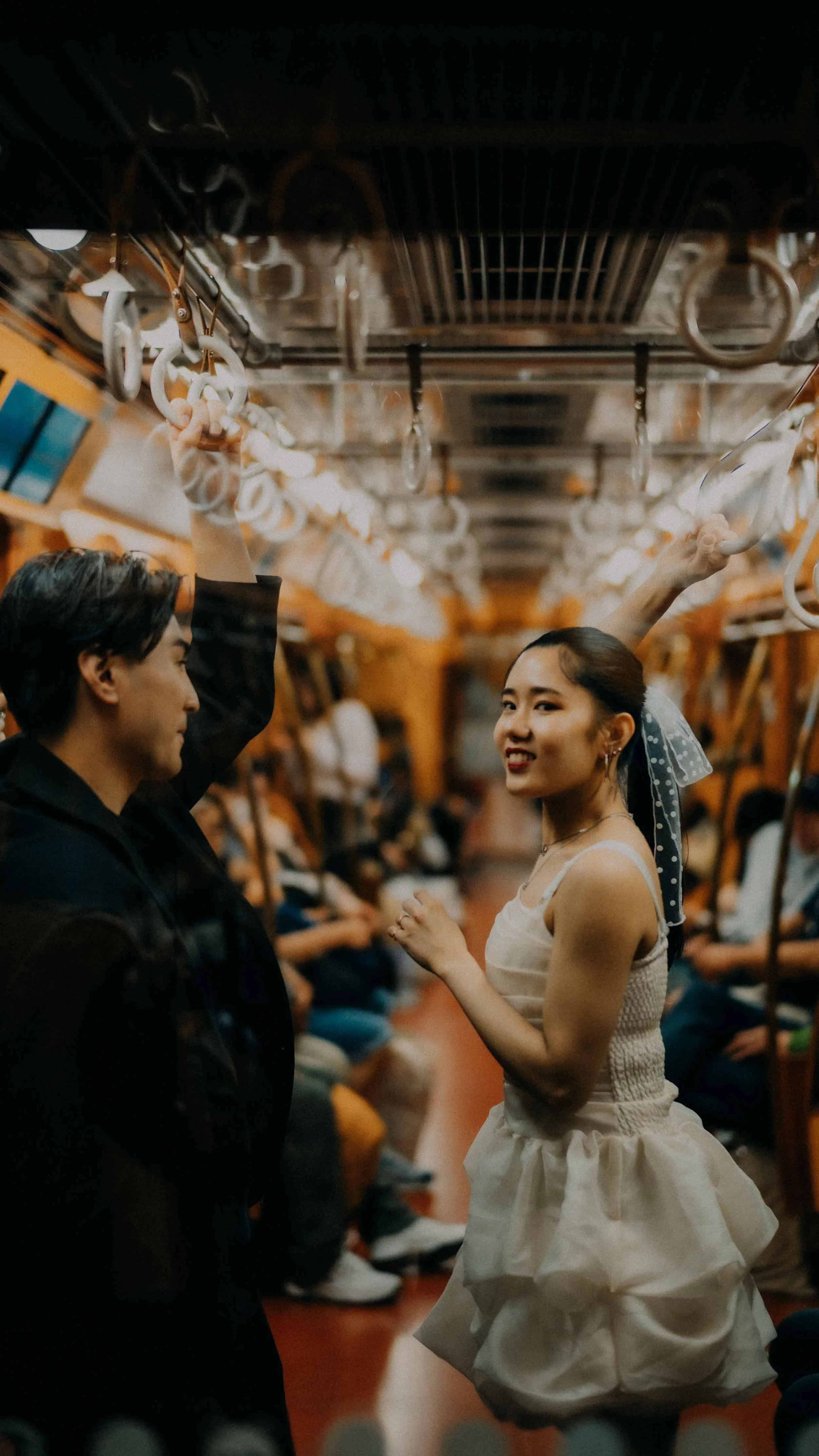13-tokyo-engagement-ginzaline-train-handles-eyecontact-leicam11.jpg