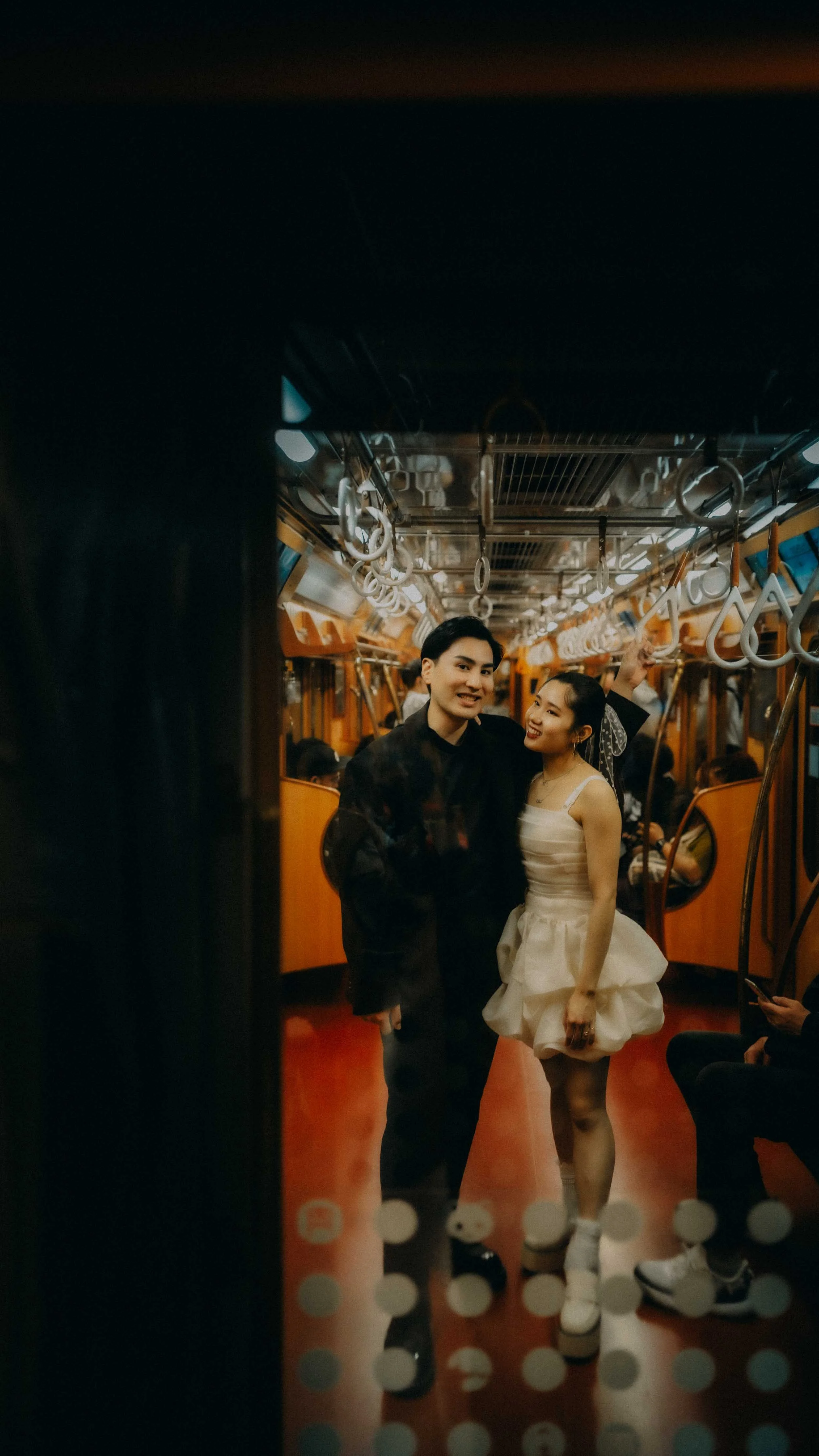 21-tokyo-engagement-ginzaline-train-doorframe-leicaq3.jpg