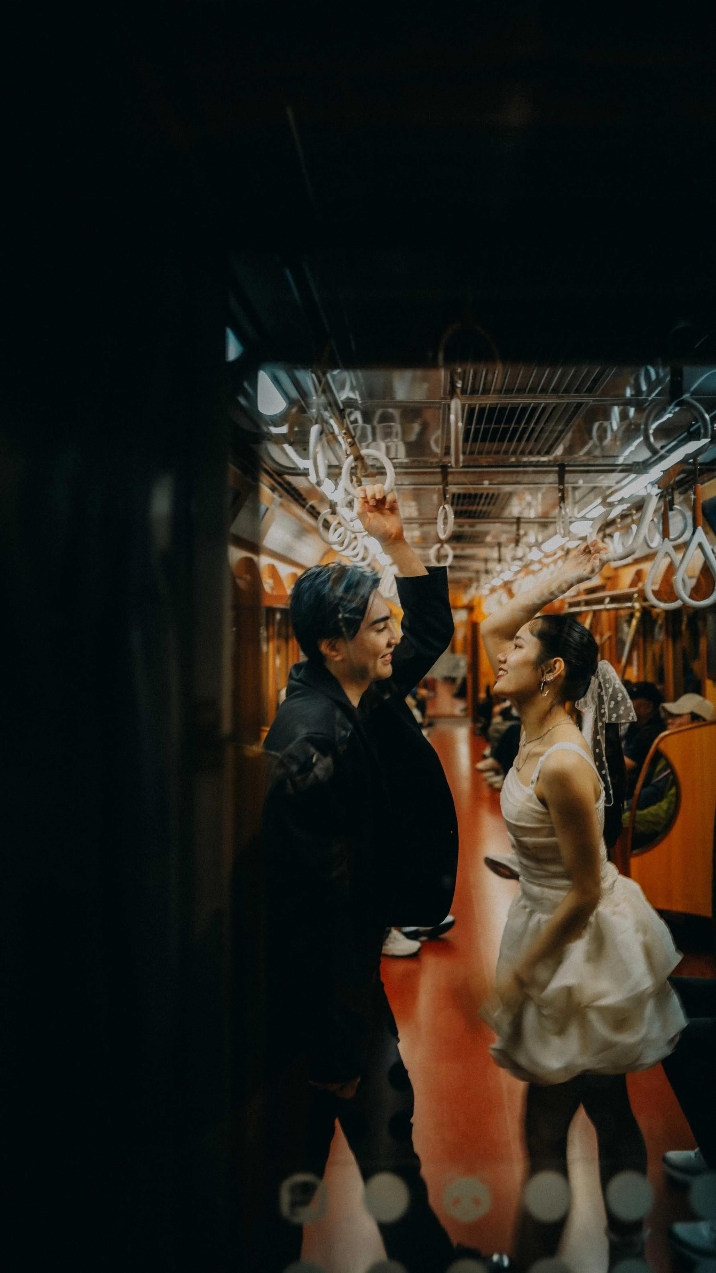 23-tokyo-engagement-ginzaline-train-handles-laughter-leicaq3.jpg