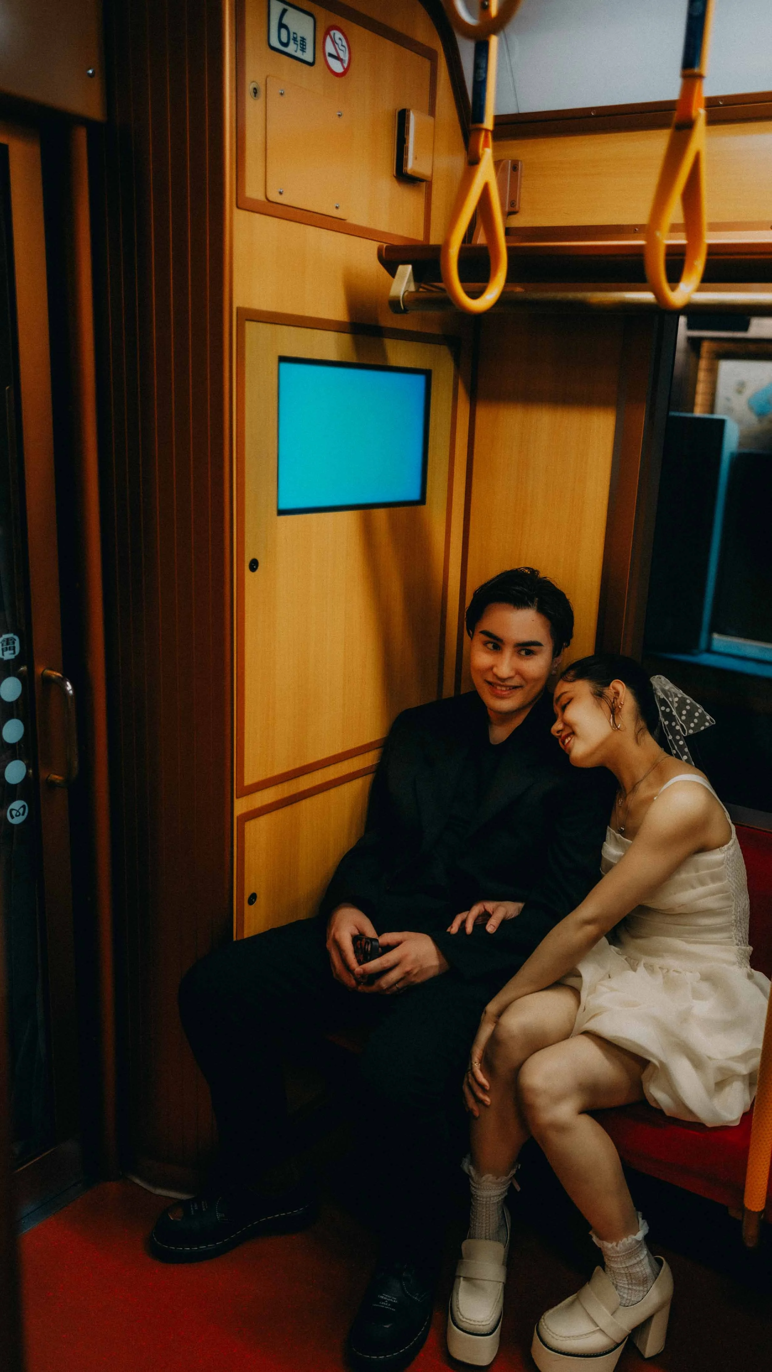 24-tokyo-engagement-ginzaline-train-seated-corner-leicaq3.jpg