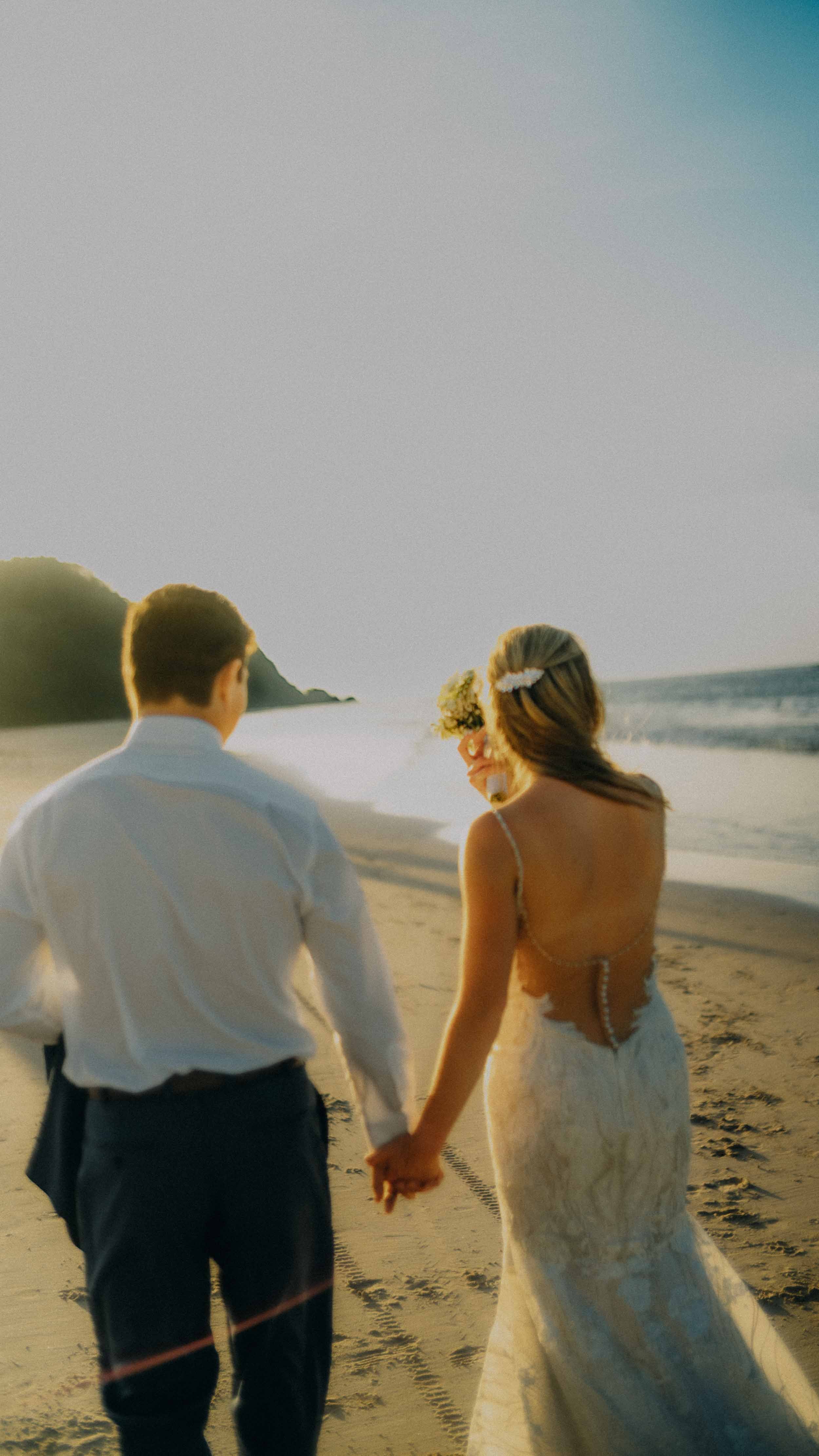 10-elnido-elopement-nacpanbeach-sunset-handinhand-sonya7rv.jpg