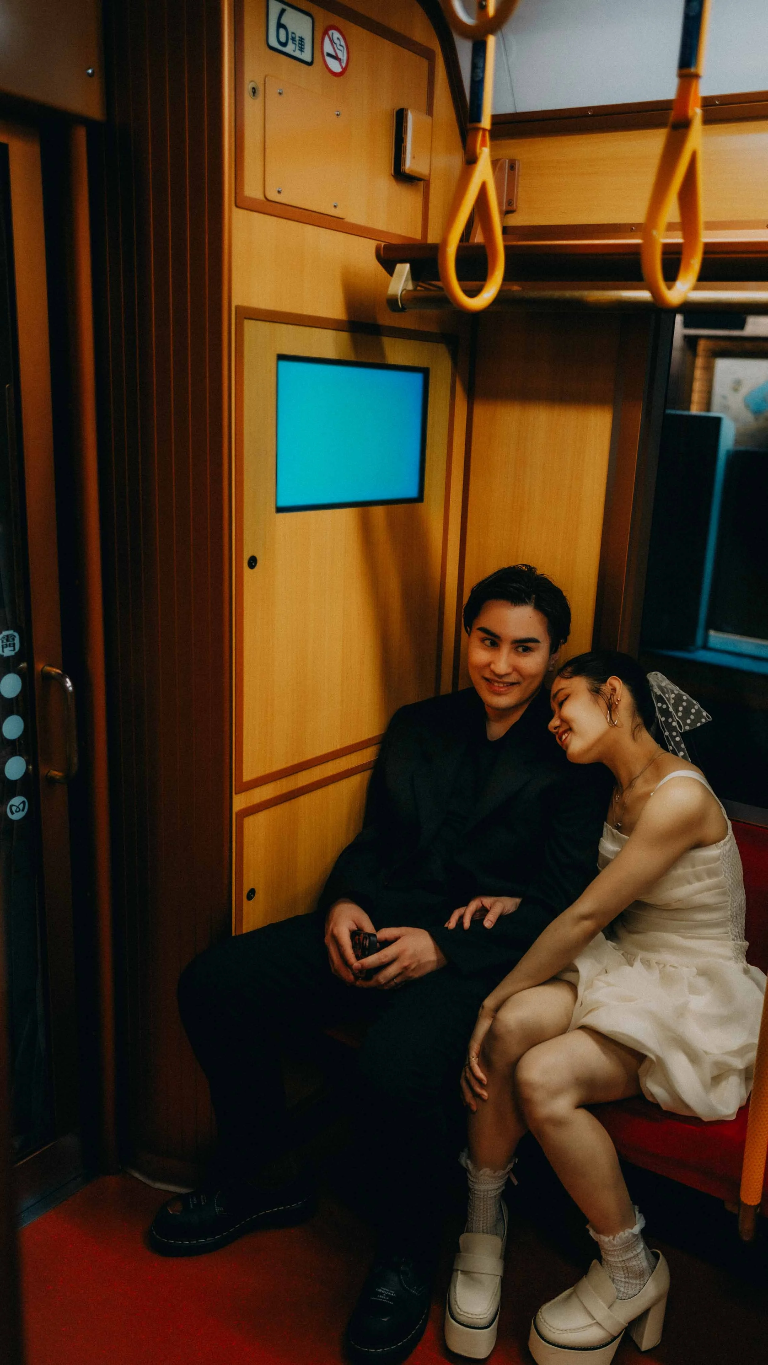 22-tokyo-engagement-ginzaline-train-seated-corner-leicaq3.jpg