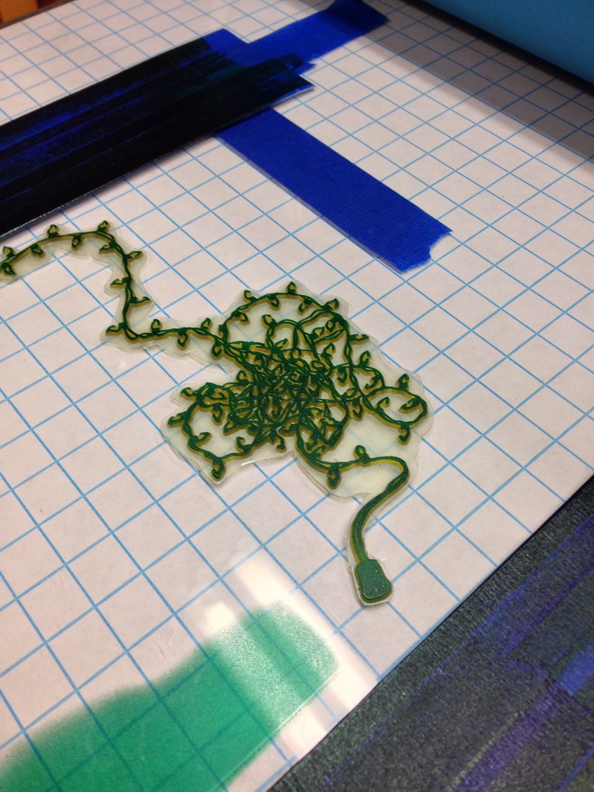 The tangled Christmas lights being printed in Dark Green. 