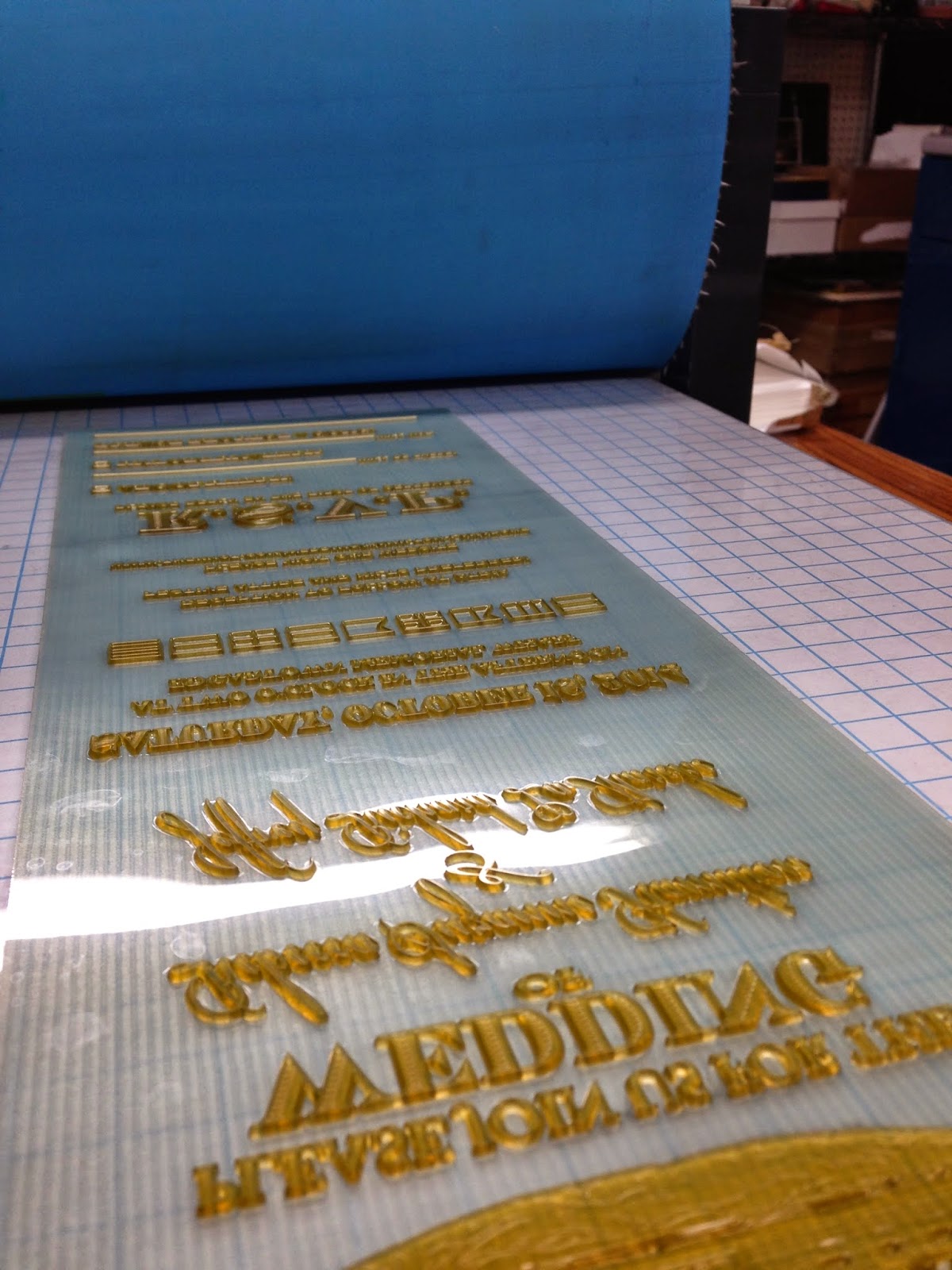 Here is the plate on press ready to go! We used the Conrad etching press due to the plates long odd size and to get the desired deep impression. 