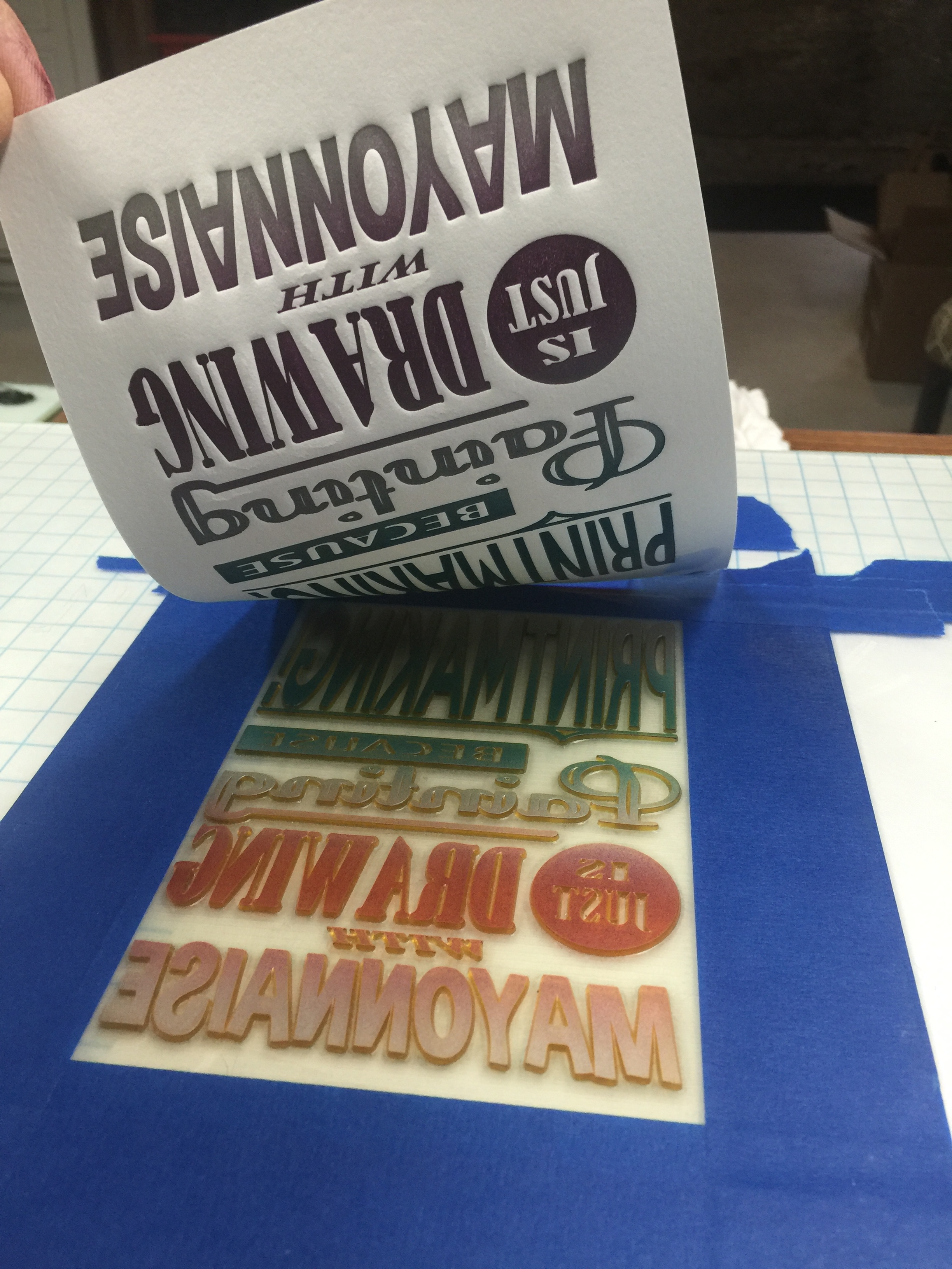 Pulling a print off of the press.