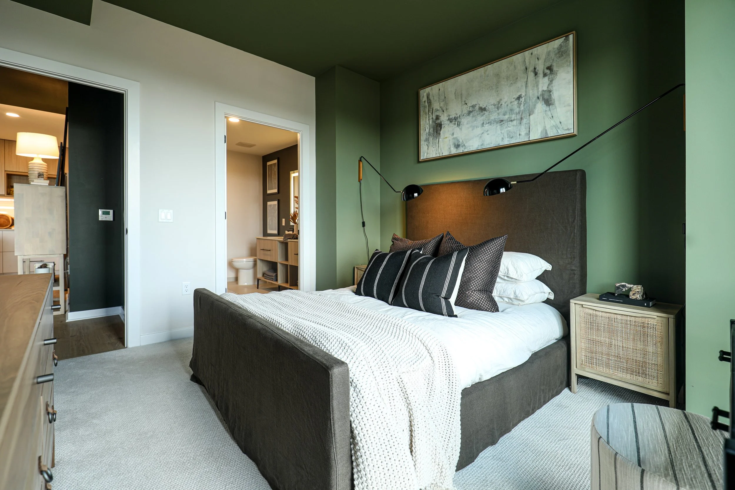 Interior architectural photography of a luxury condominium bedroom designed for marketing and leasing.