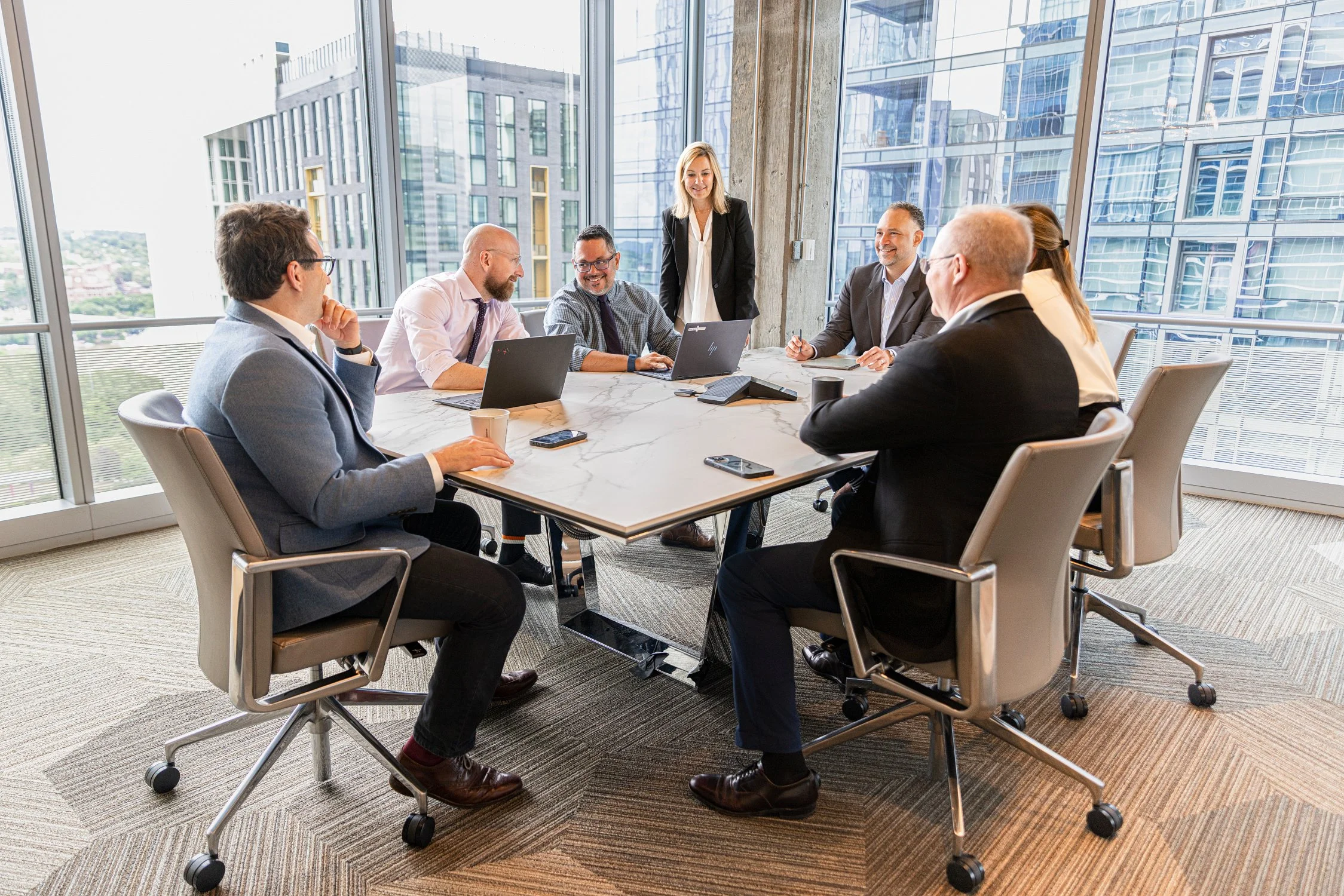 Corporate branding photography capturing colleagues collaborating in a modern office environment.