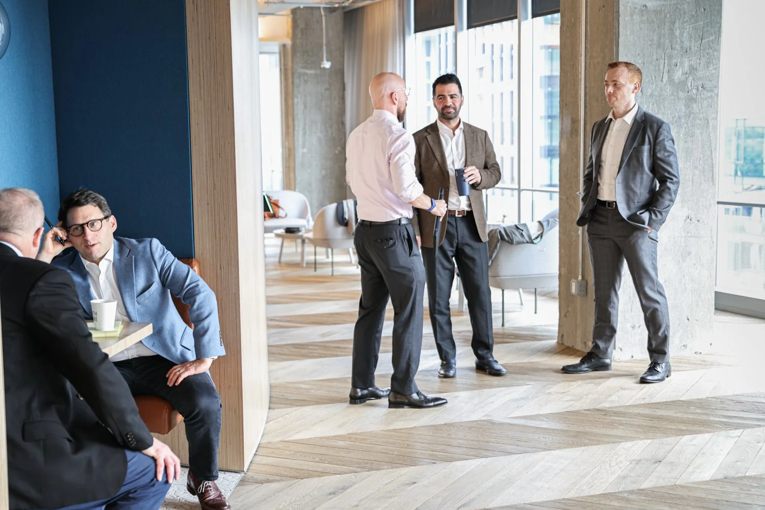 Corporate lifestyle photography documenting Rocade Capital employees in an architectural setting.