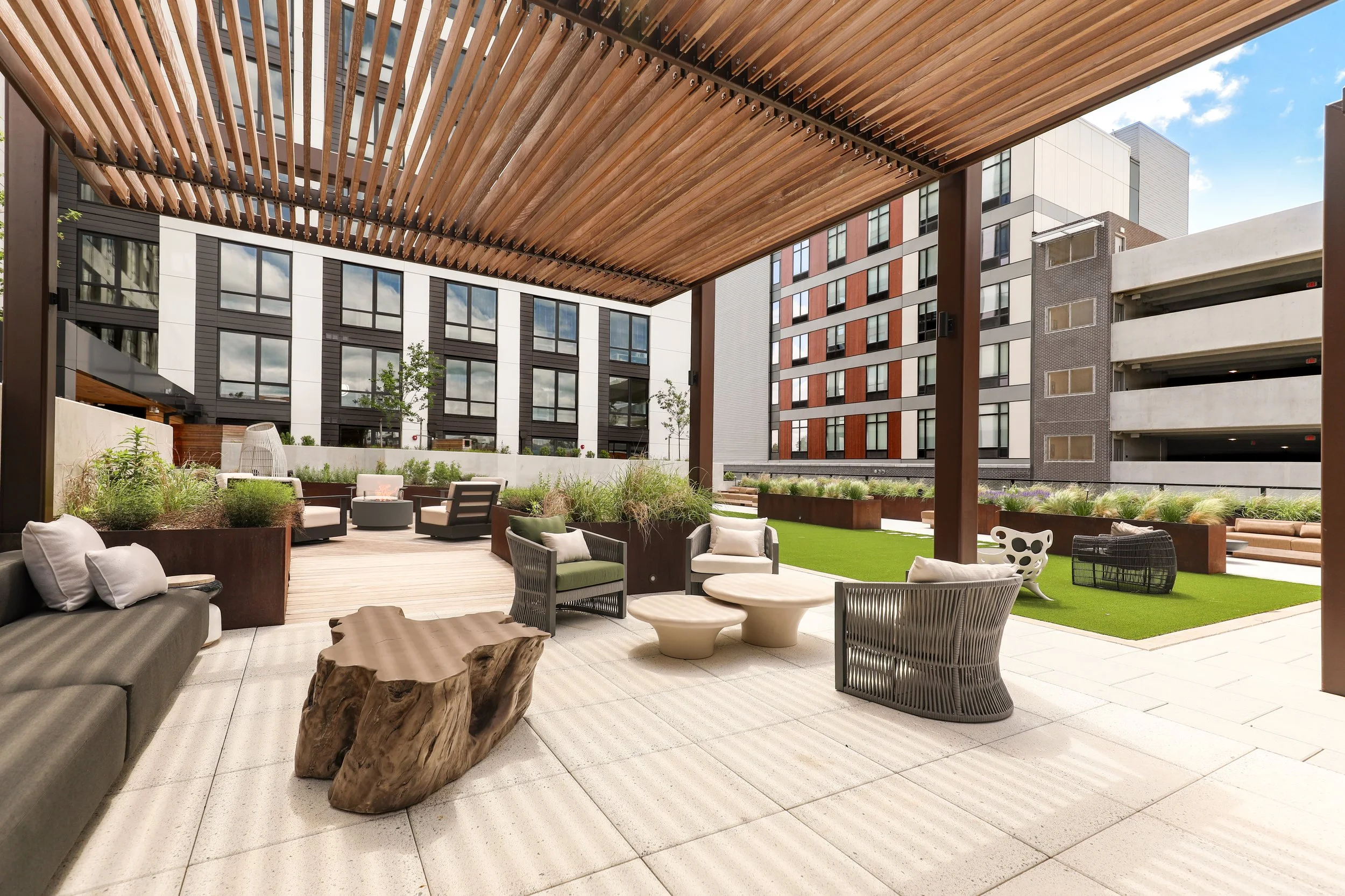 Exterior architectural photograph showcasing the contemporary design of The Oak at West Falls multifamily development.