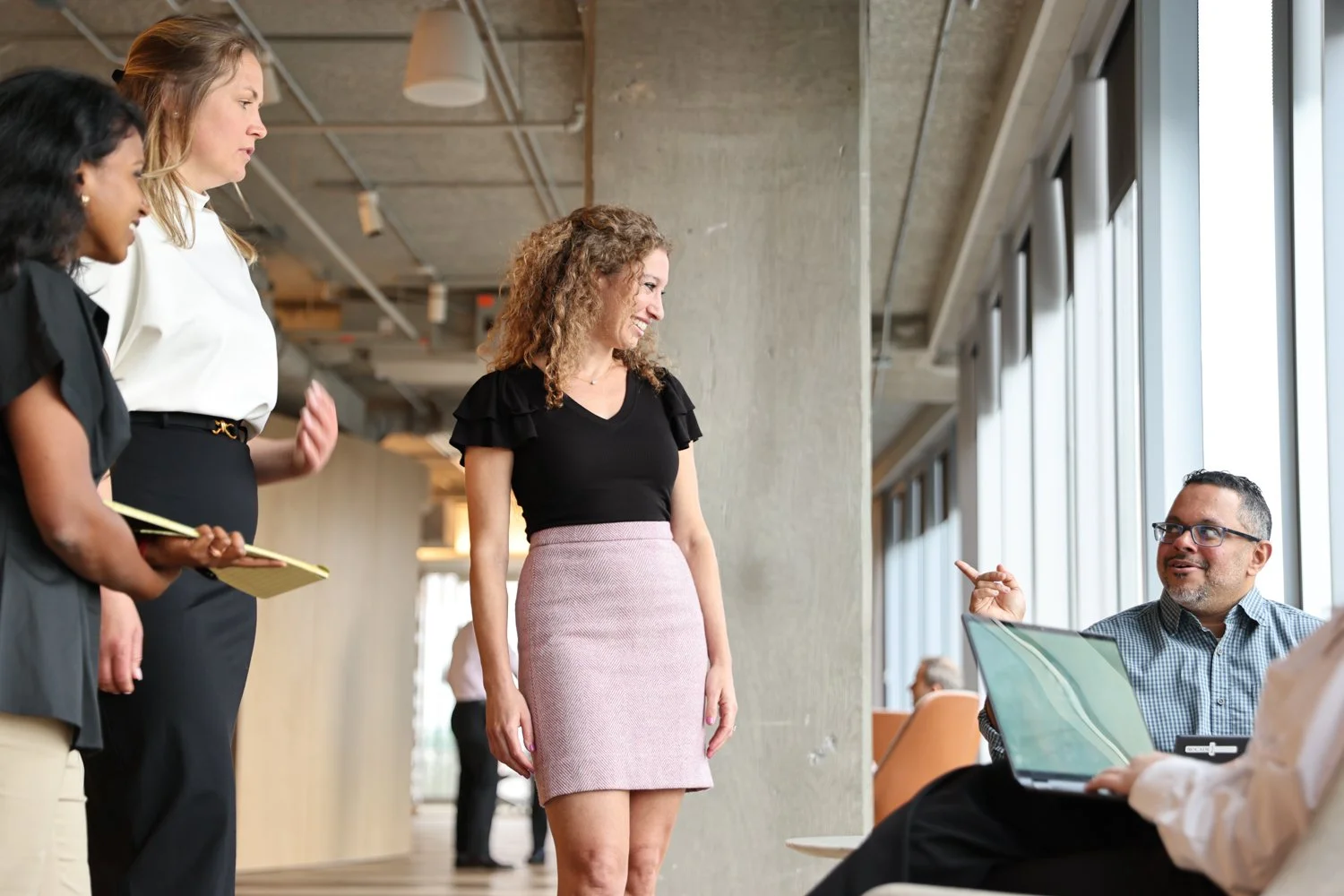 Corporate branding photography capturing authentic workplace interactions between Rocade Capital team members.
